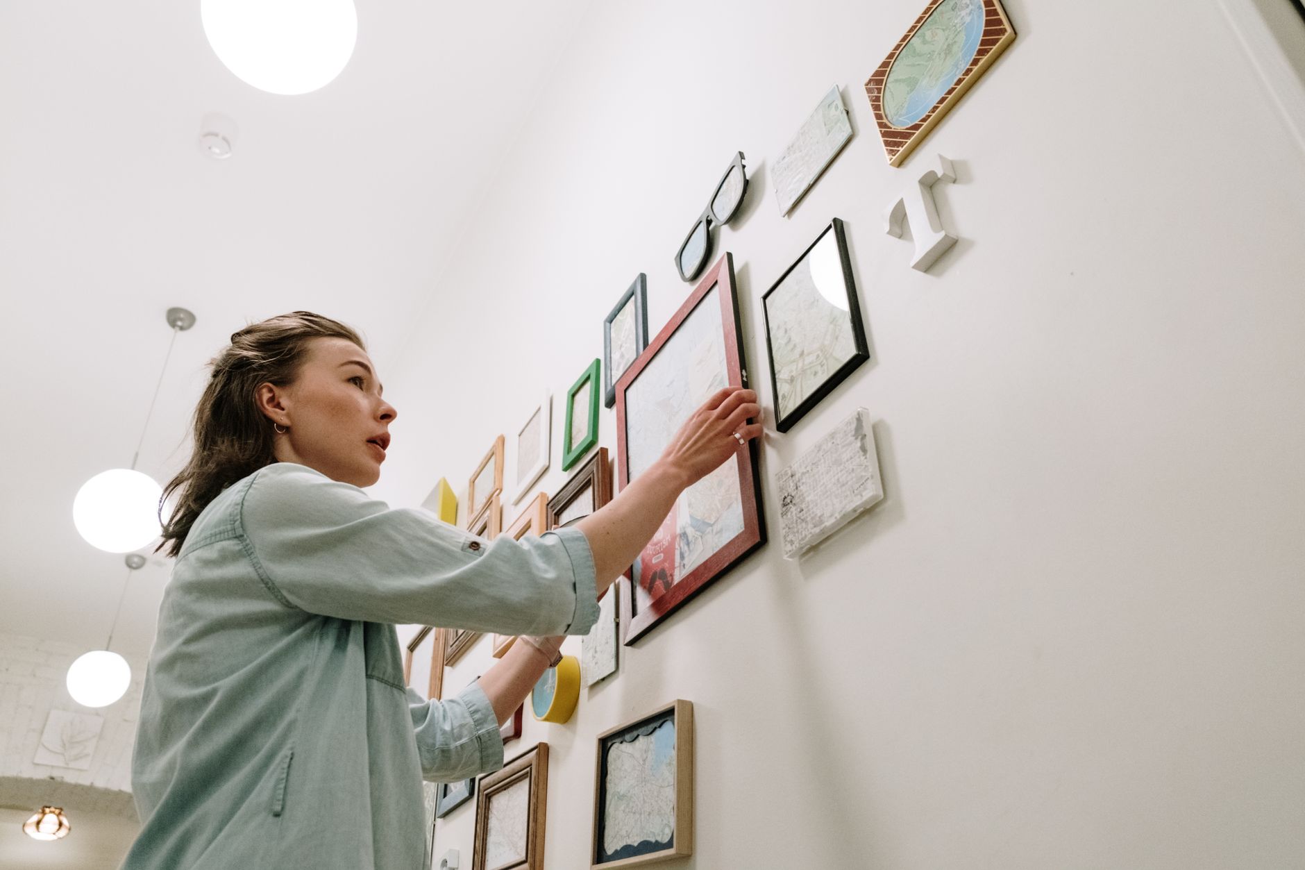 Best laser level: a neat row of picture frames on a living room wall