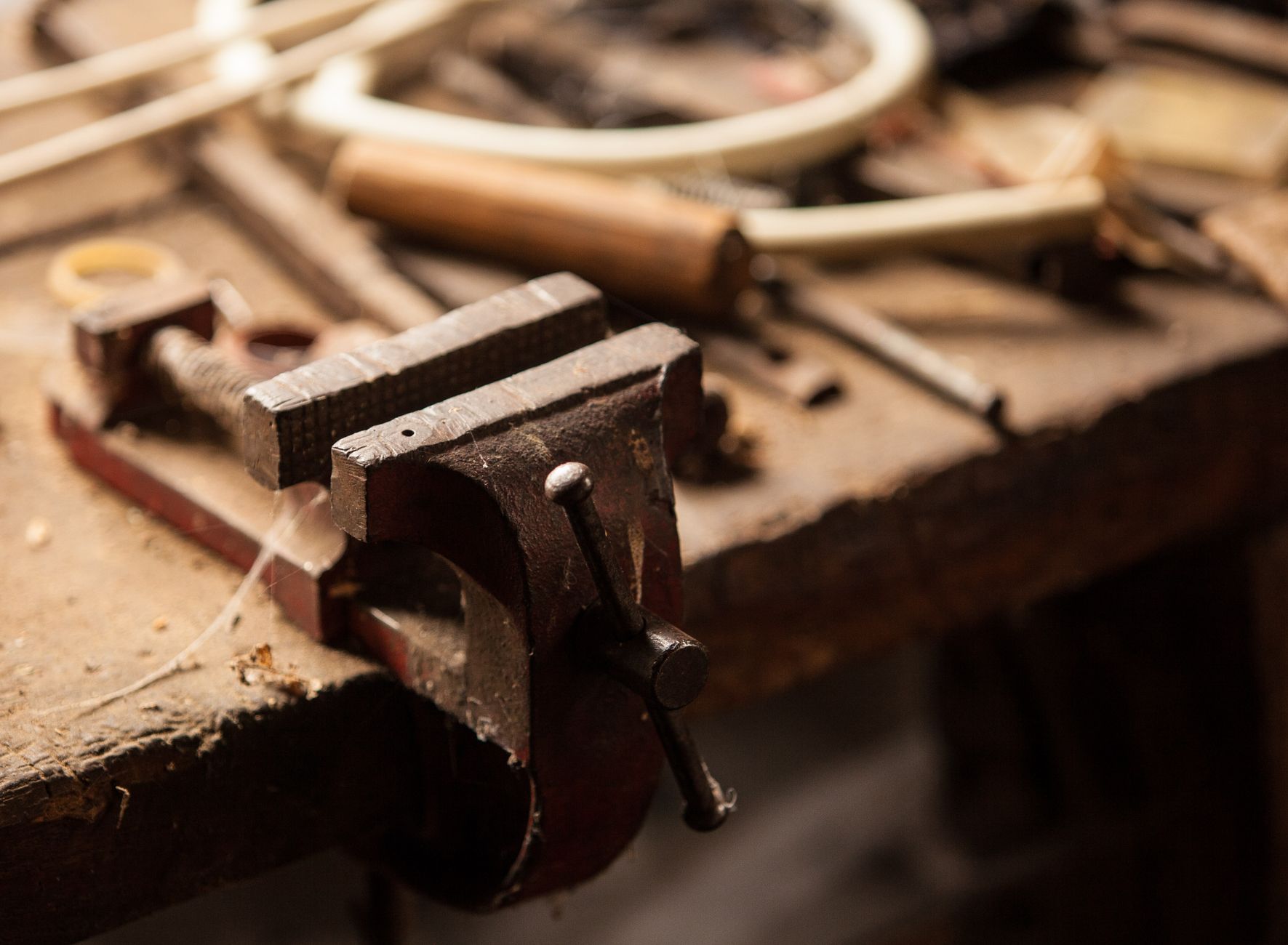 Hand tools laid out on a workbench