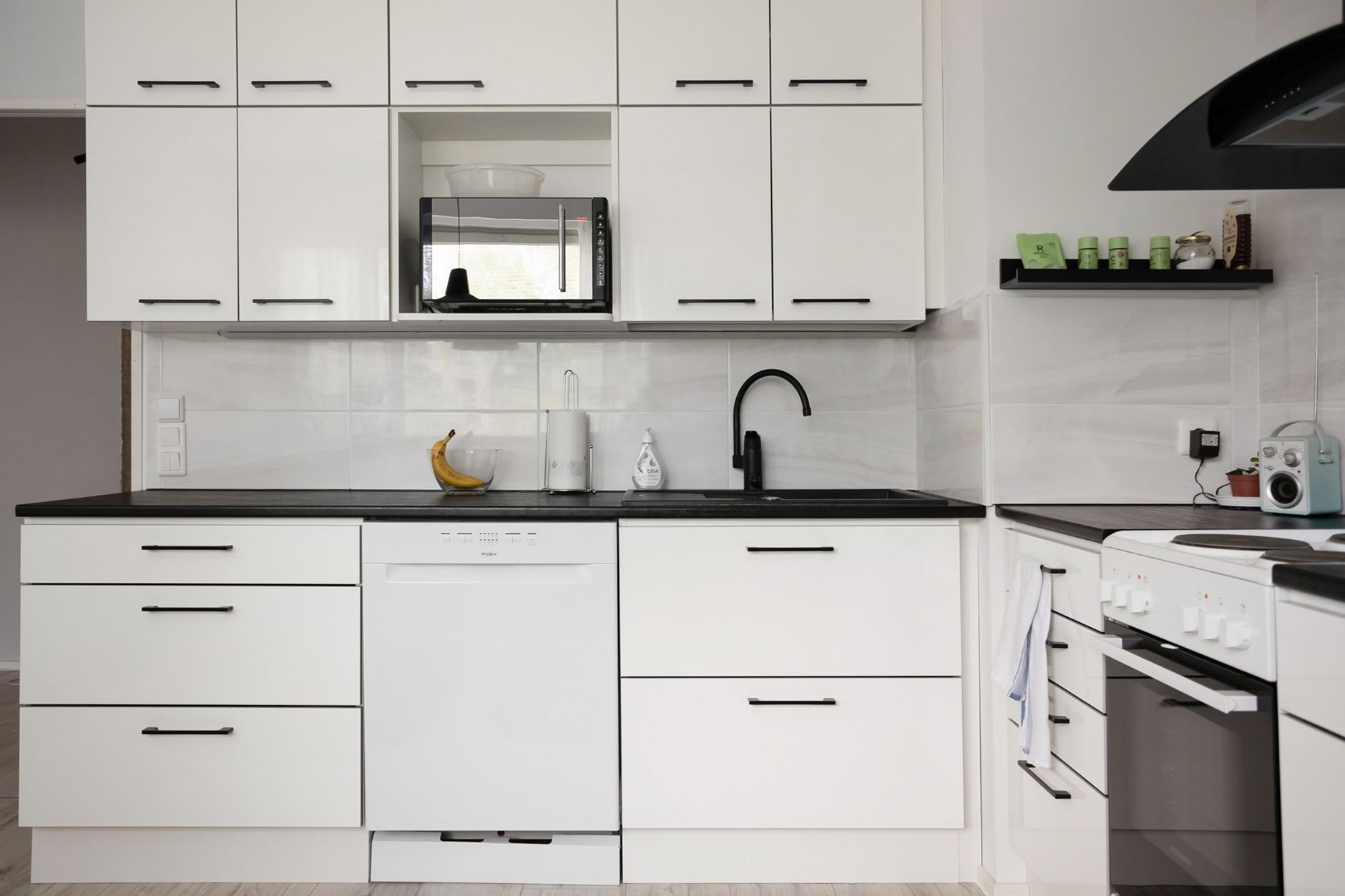 A row of white kitchen cabinets