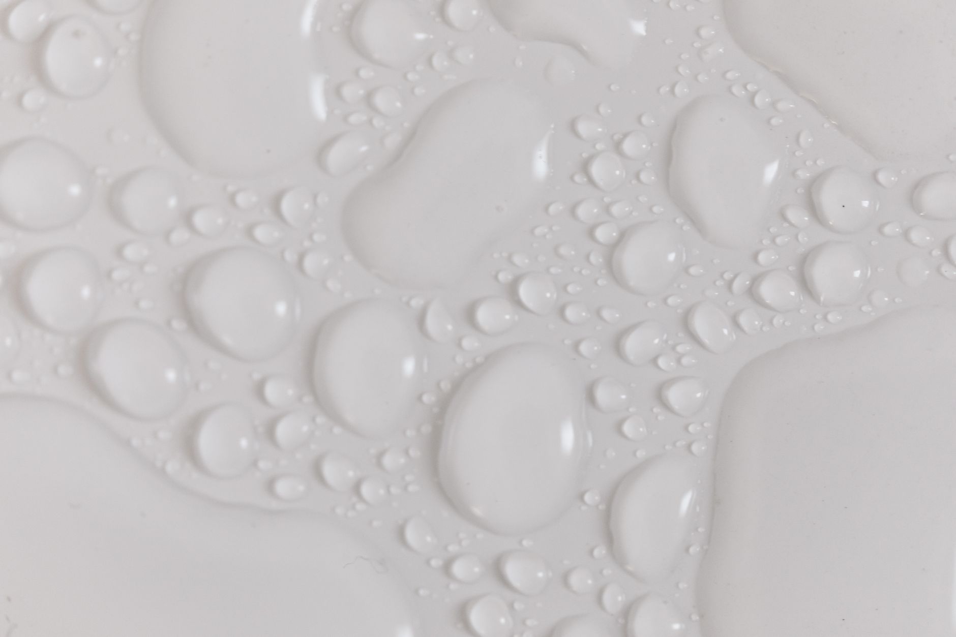 Water droplets on a white surface