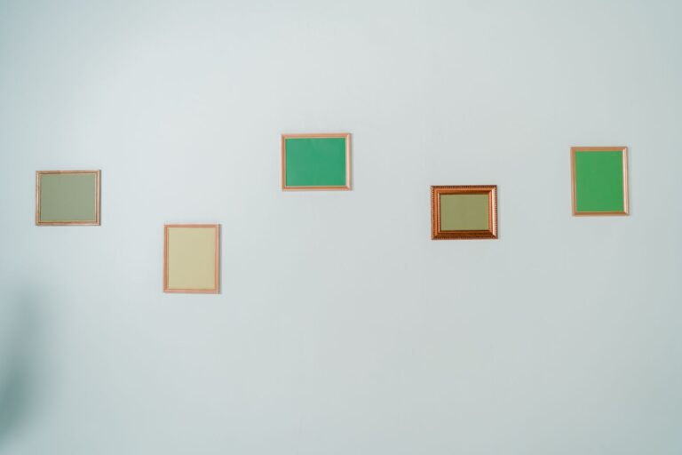 Best level for home projects: a picture frame being hung on a wall