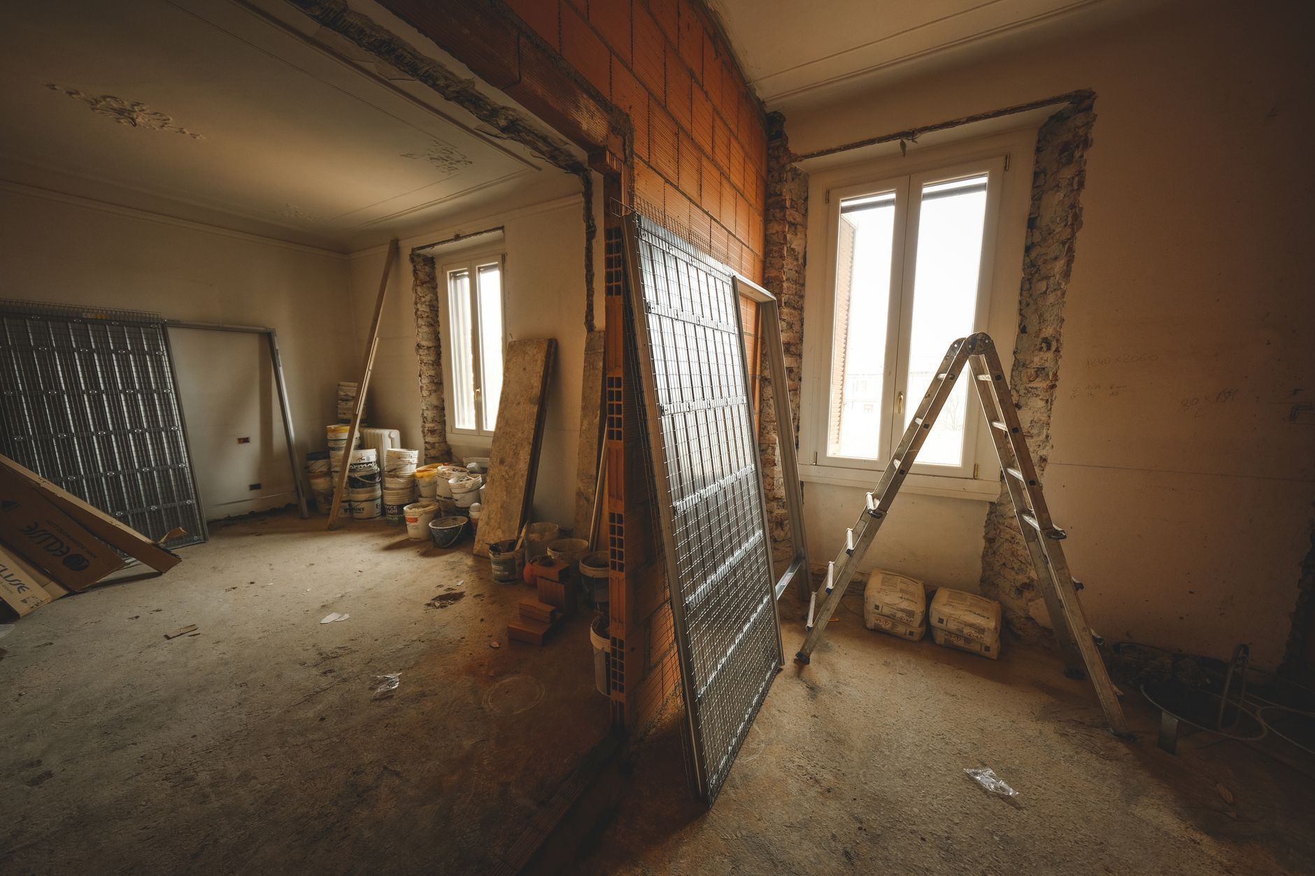 A room with bare drywall during a renovation