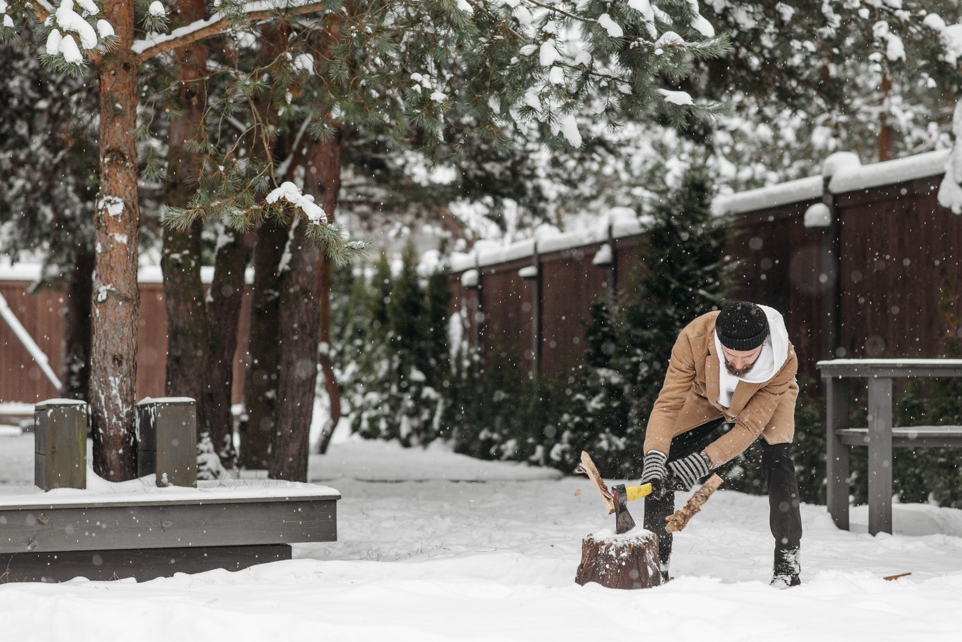 Firewood being prepared outdoors in cold weather