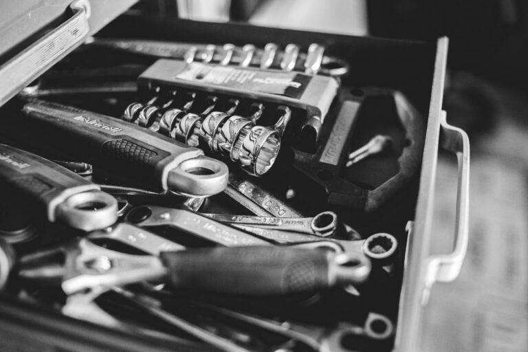 Best magnetic parts tray: hand tools laid out in a home garage