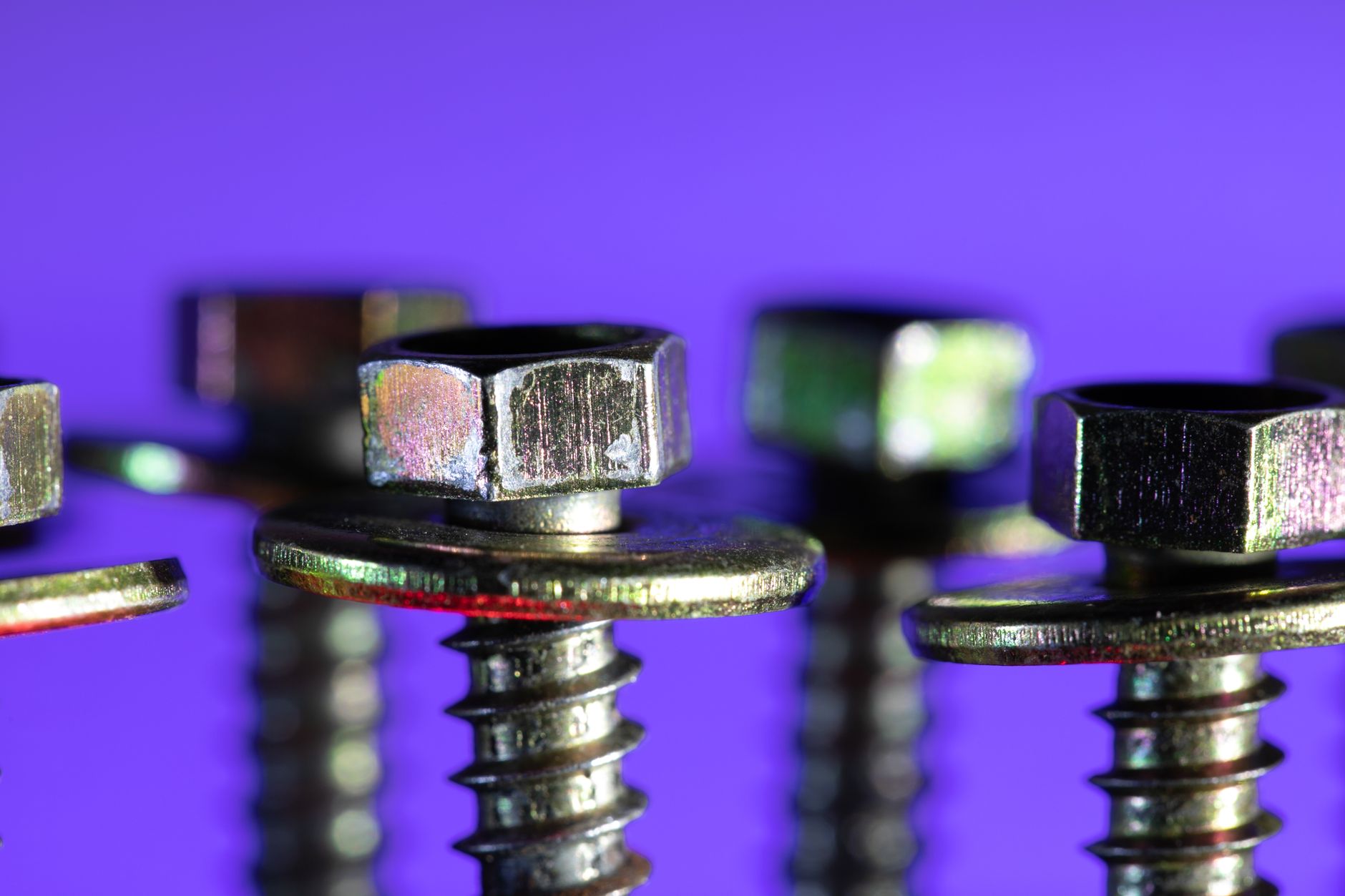 A pile of small screws, nuts and bolts