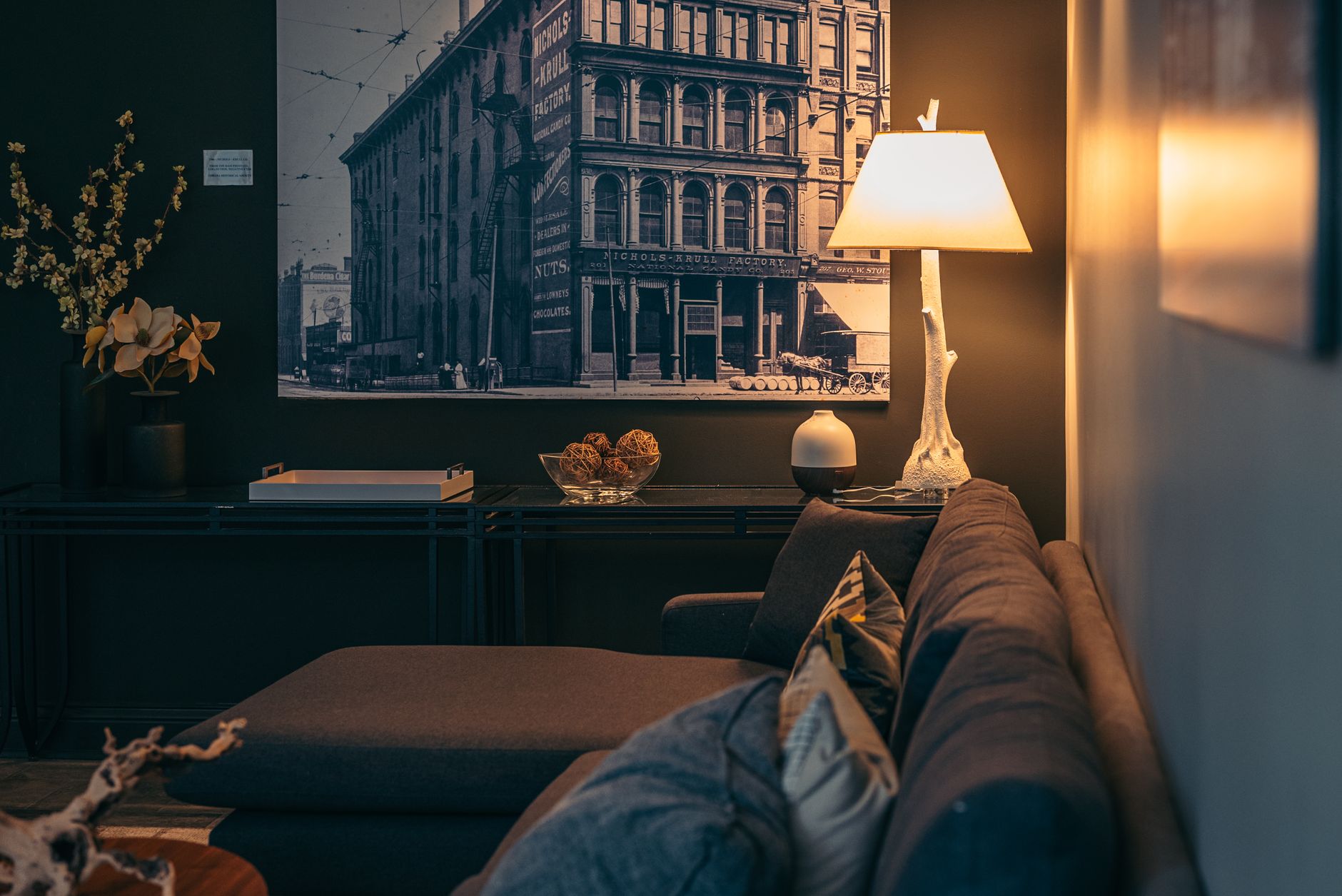 A table lamp lighting a living room corner