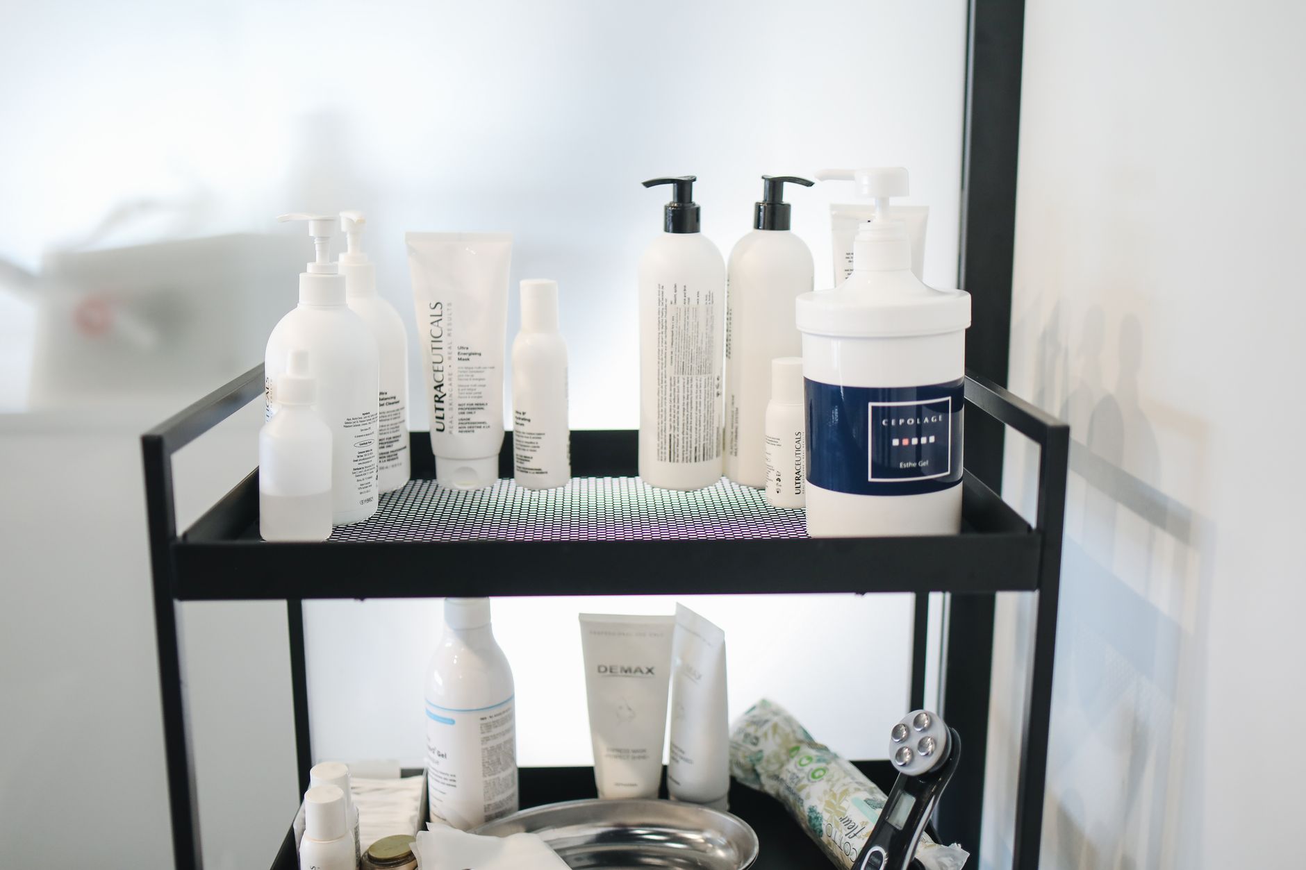 Skincare bottles lined up on a shelf