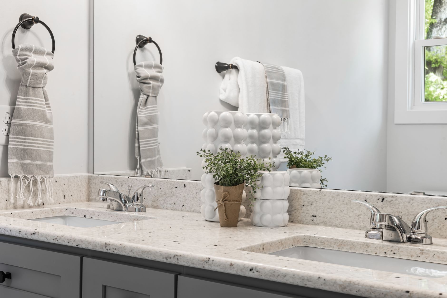 A tidy bathroom counter beside a sink