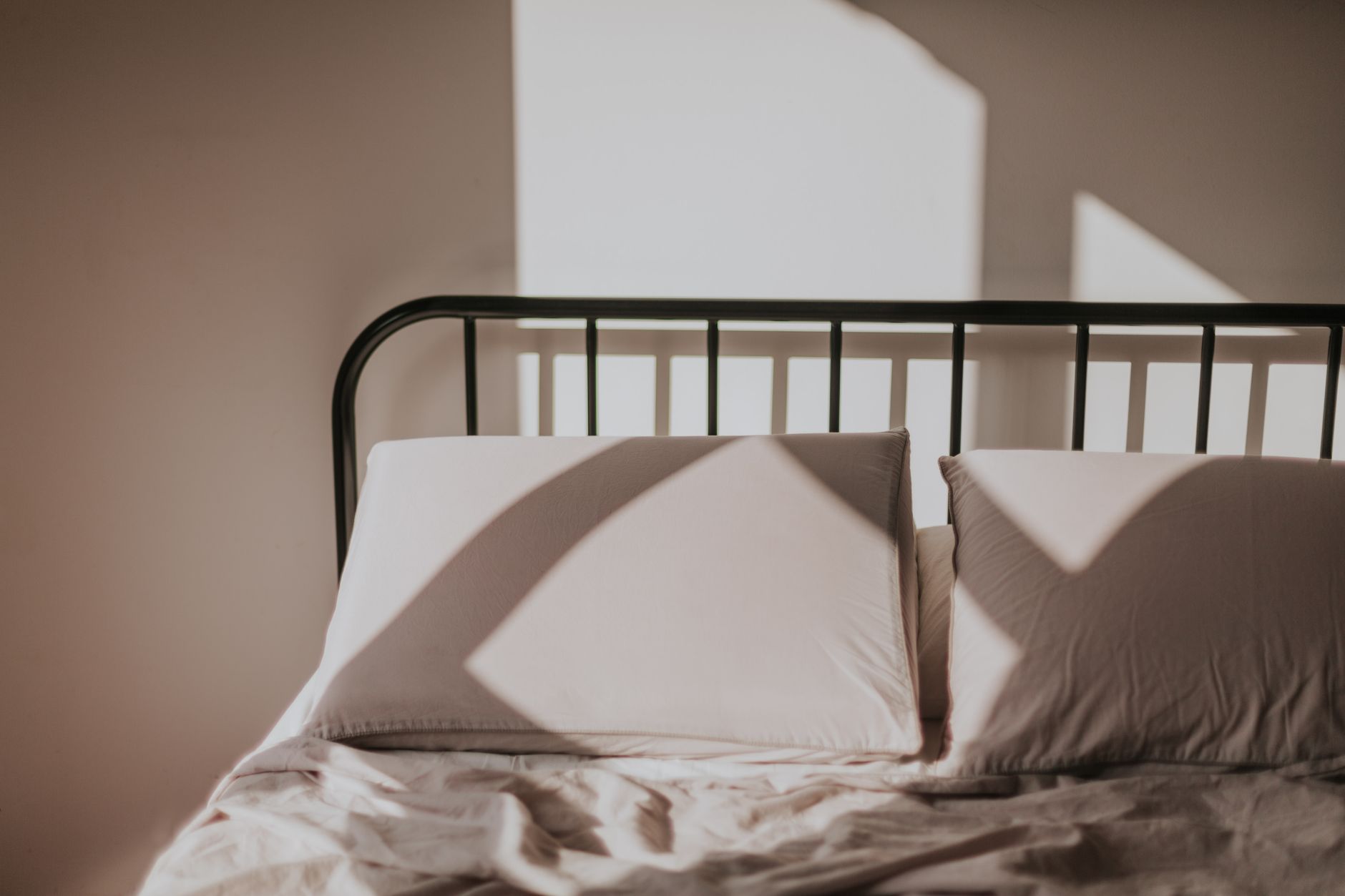 Pillows on a bed with a metal frame