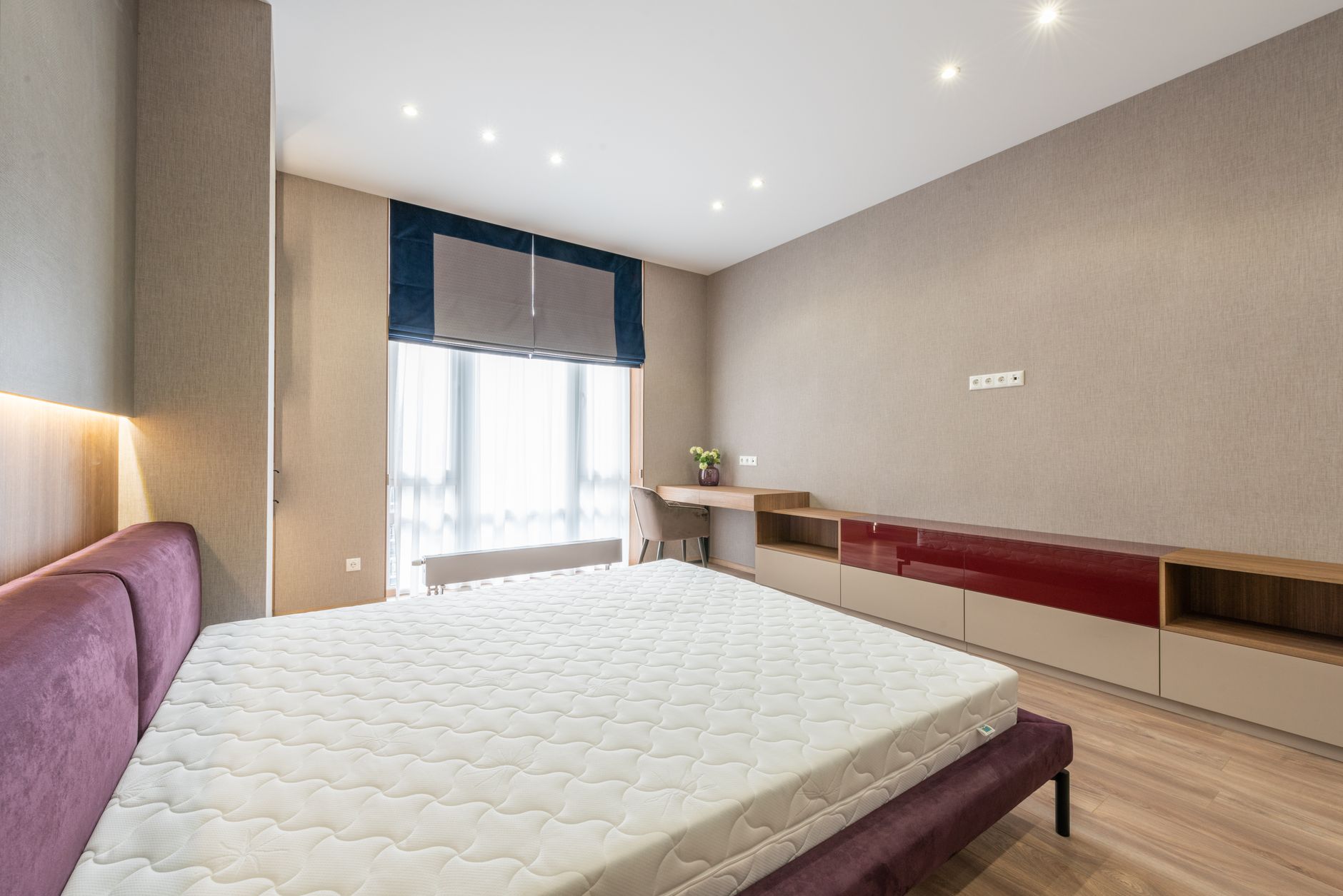 A bare mattress in a modern bedroom