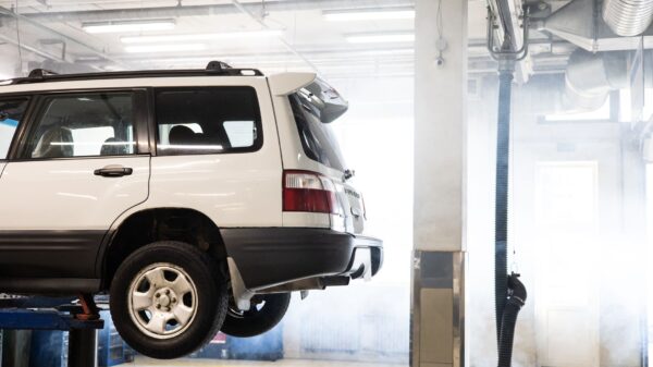 Best mechanic creeper: an SUV raised on a lift in a garage