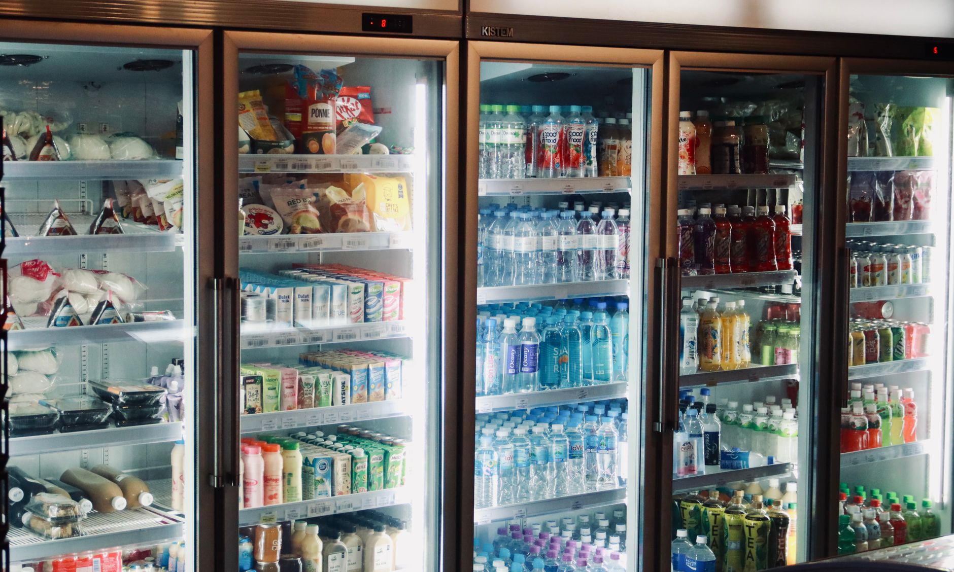 Glass-door drink coolers stocked with beverages