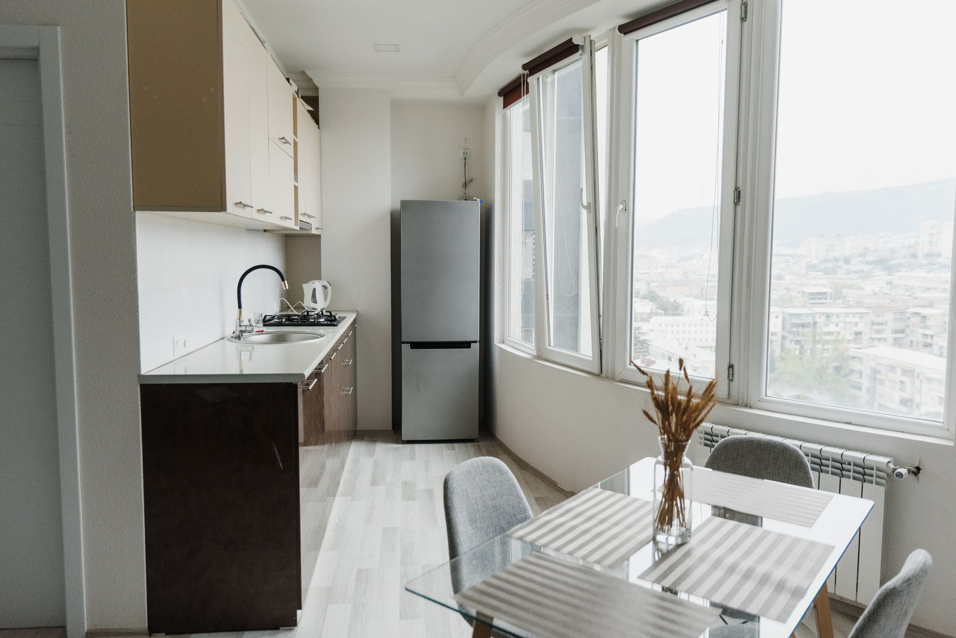 Best mini fridge stand: a bright apartment kitchen