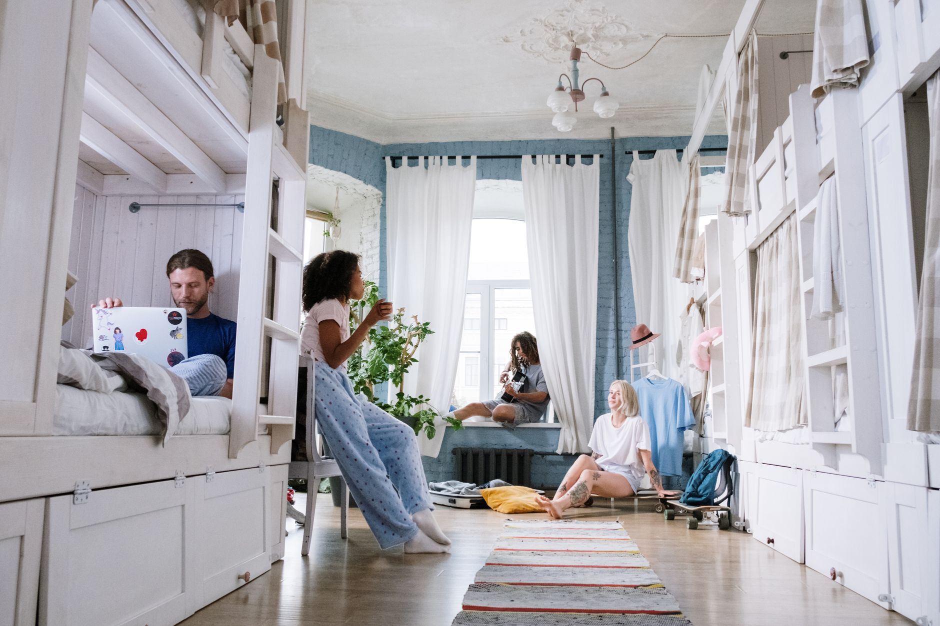 Friends relaxing in a shared bunk room