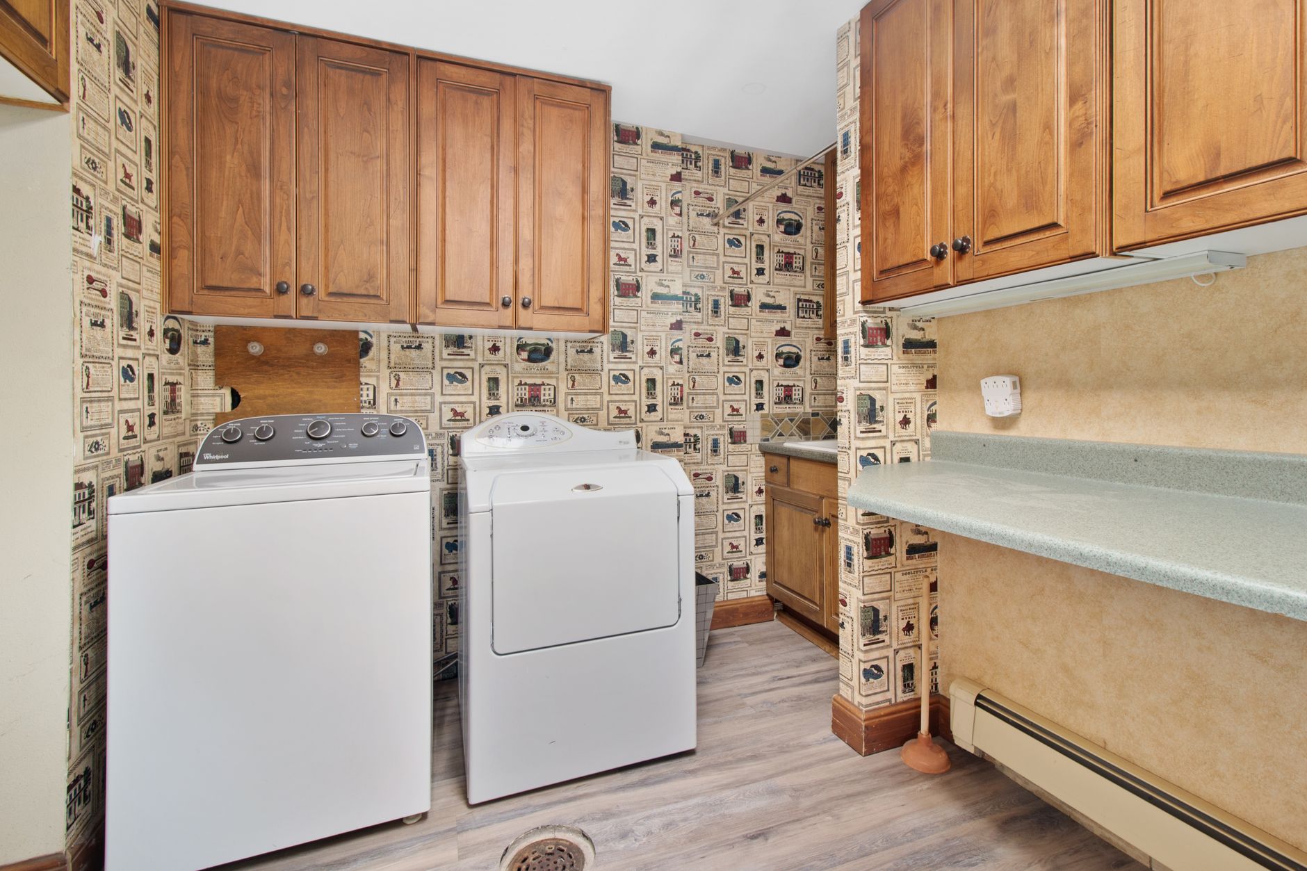 A washer and dryer in a laundry room