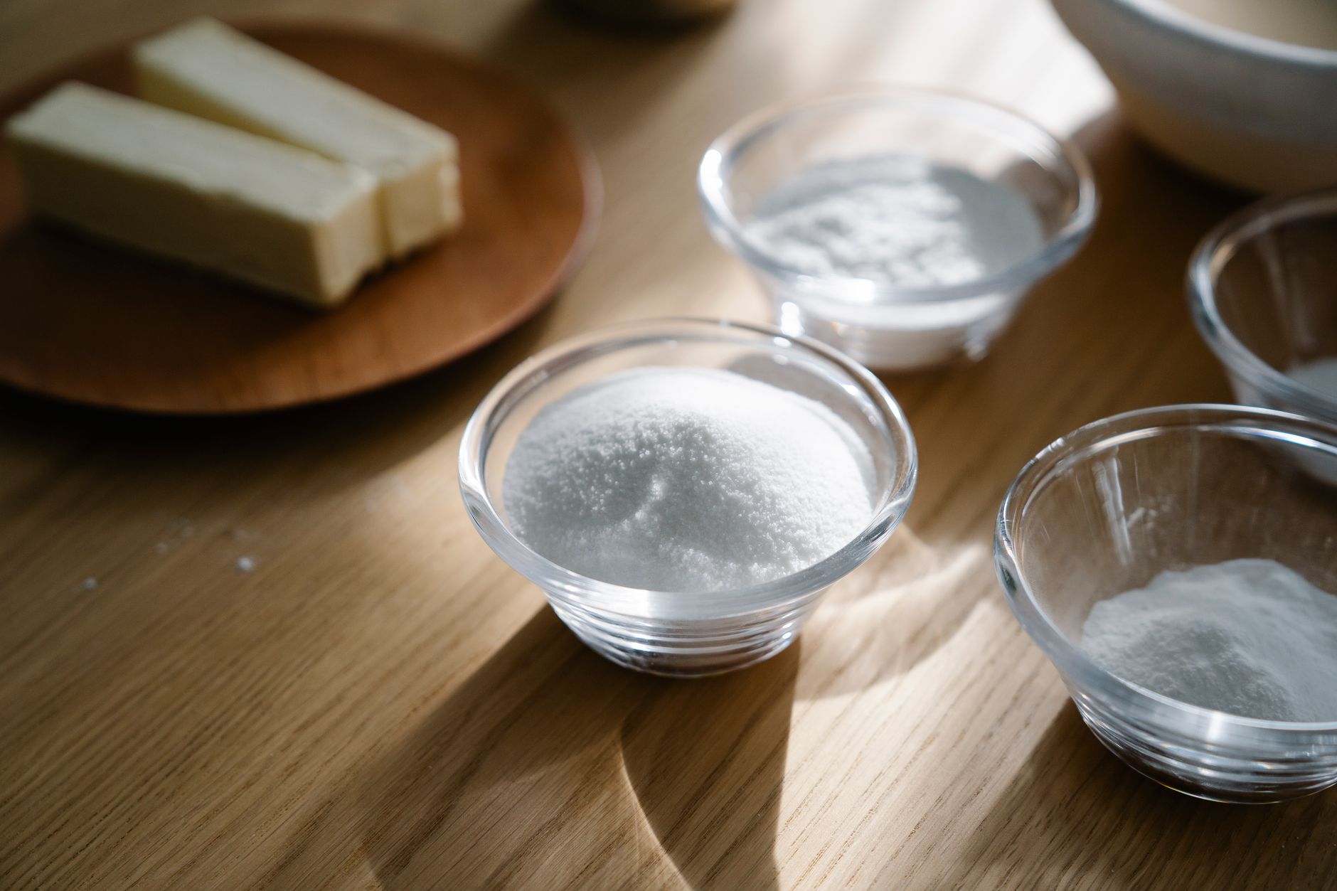 Sugar and flour in small glass bowls