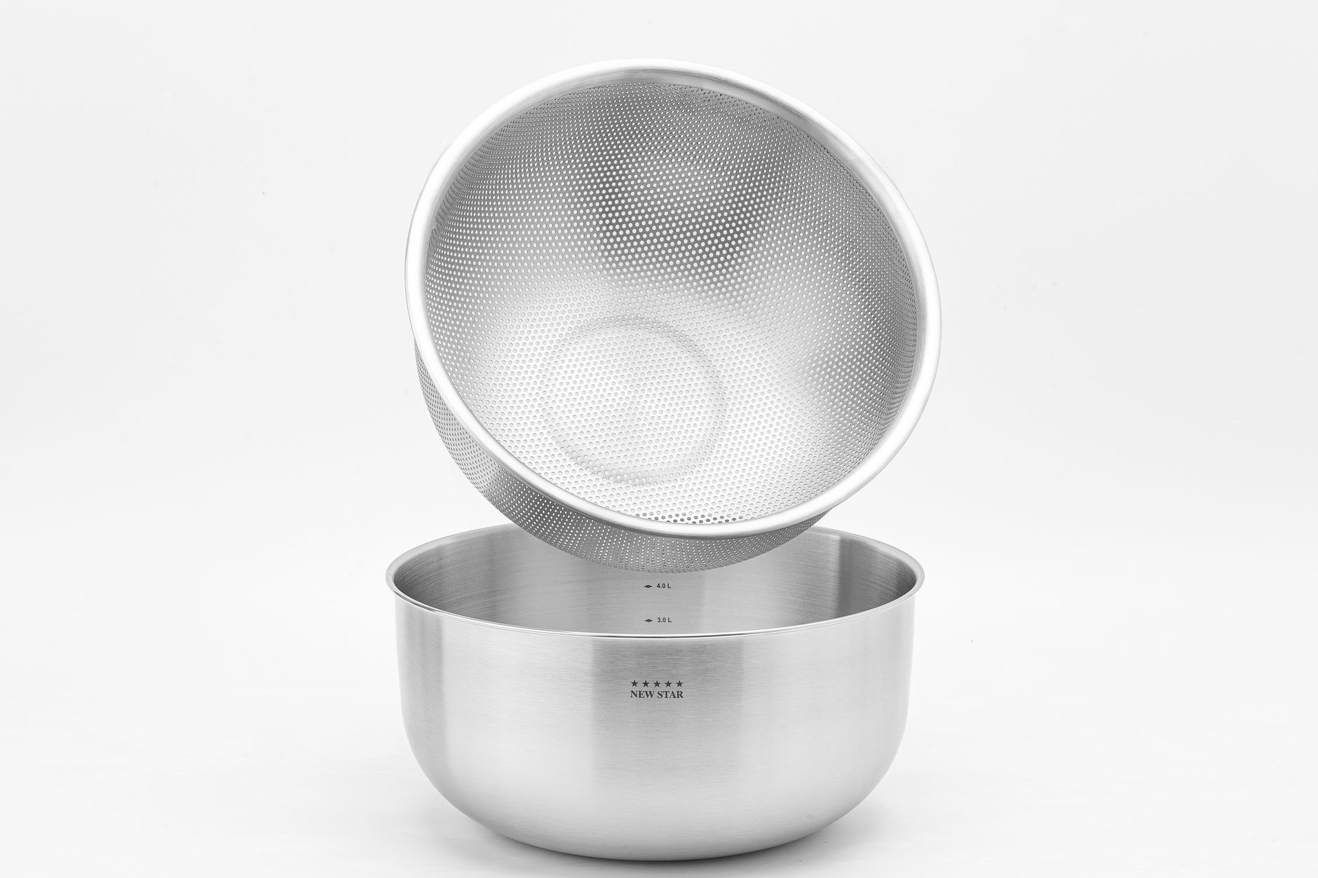 A stainless steel colander and bowl