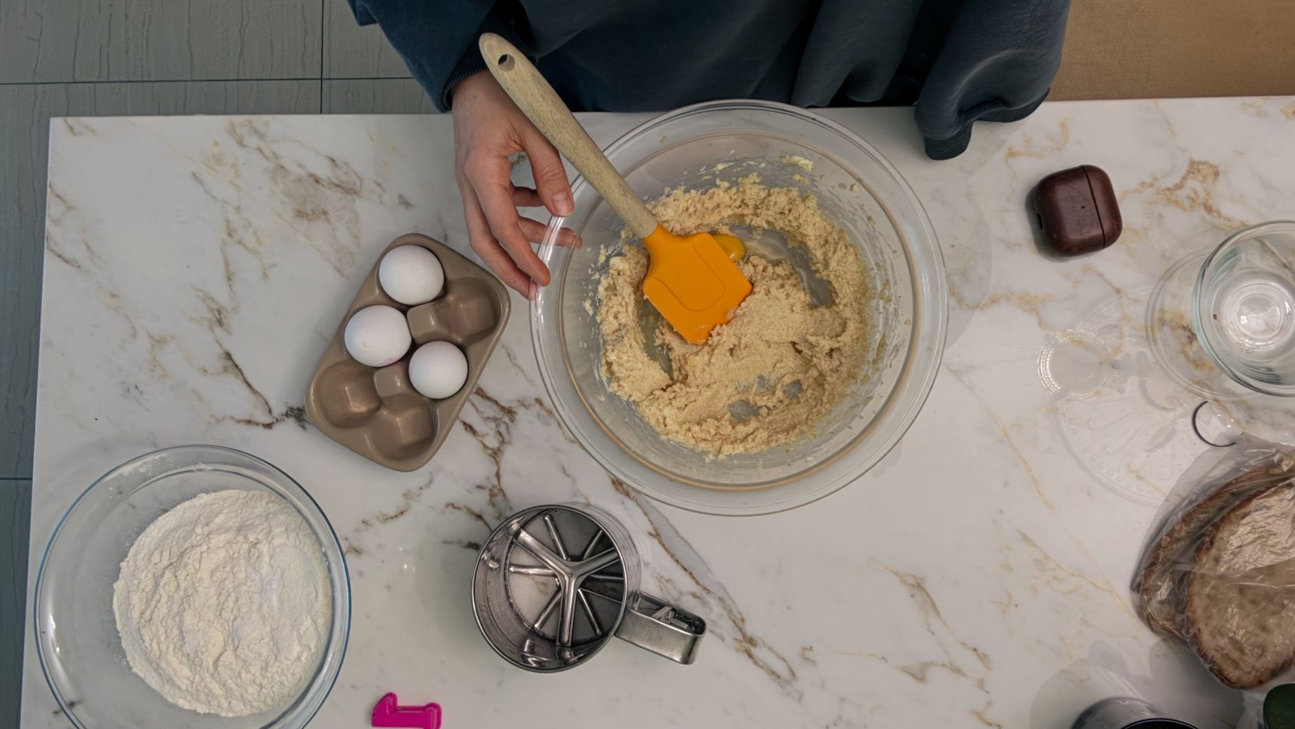 Mixing cookie dough in a glass bowl