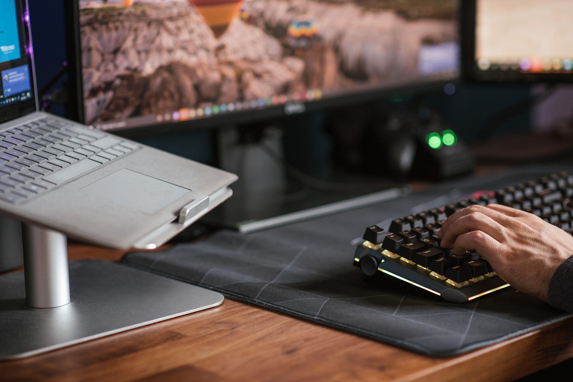 A computer desk with a monitor and keyboard