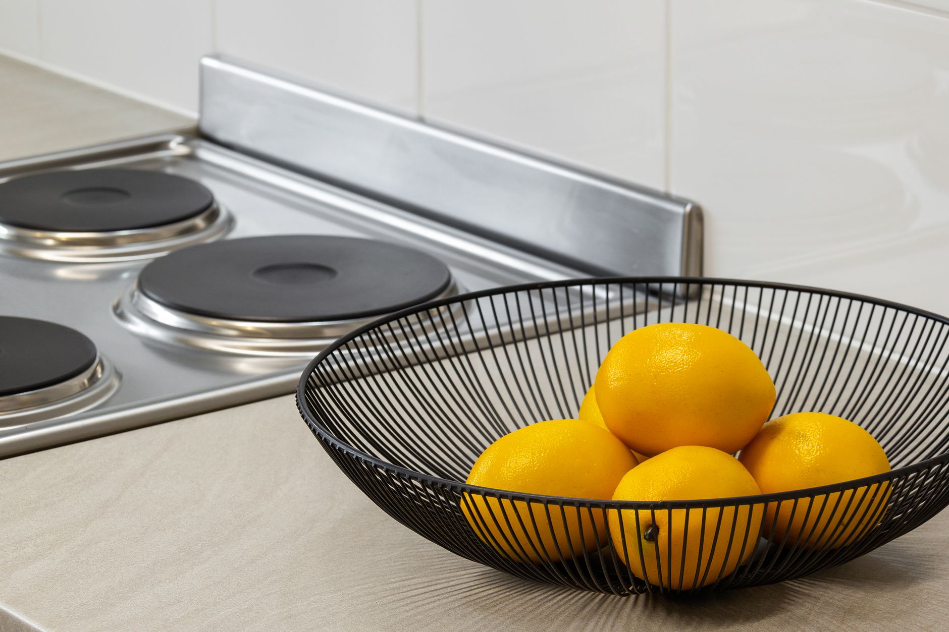 A bowl of fresh fruit on a kitchen counter