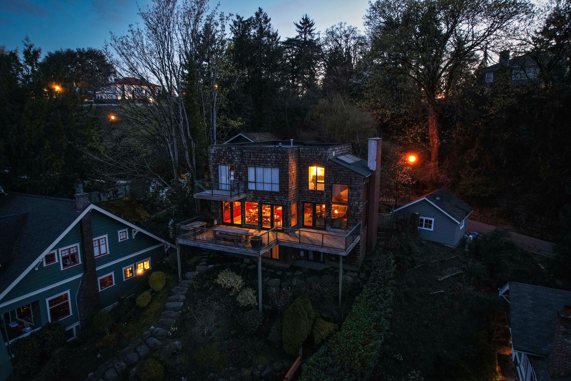 A house with lit windows at dusk