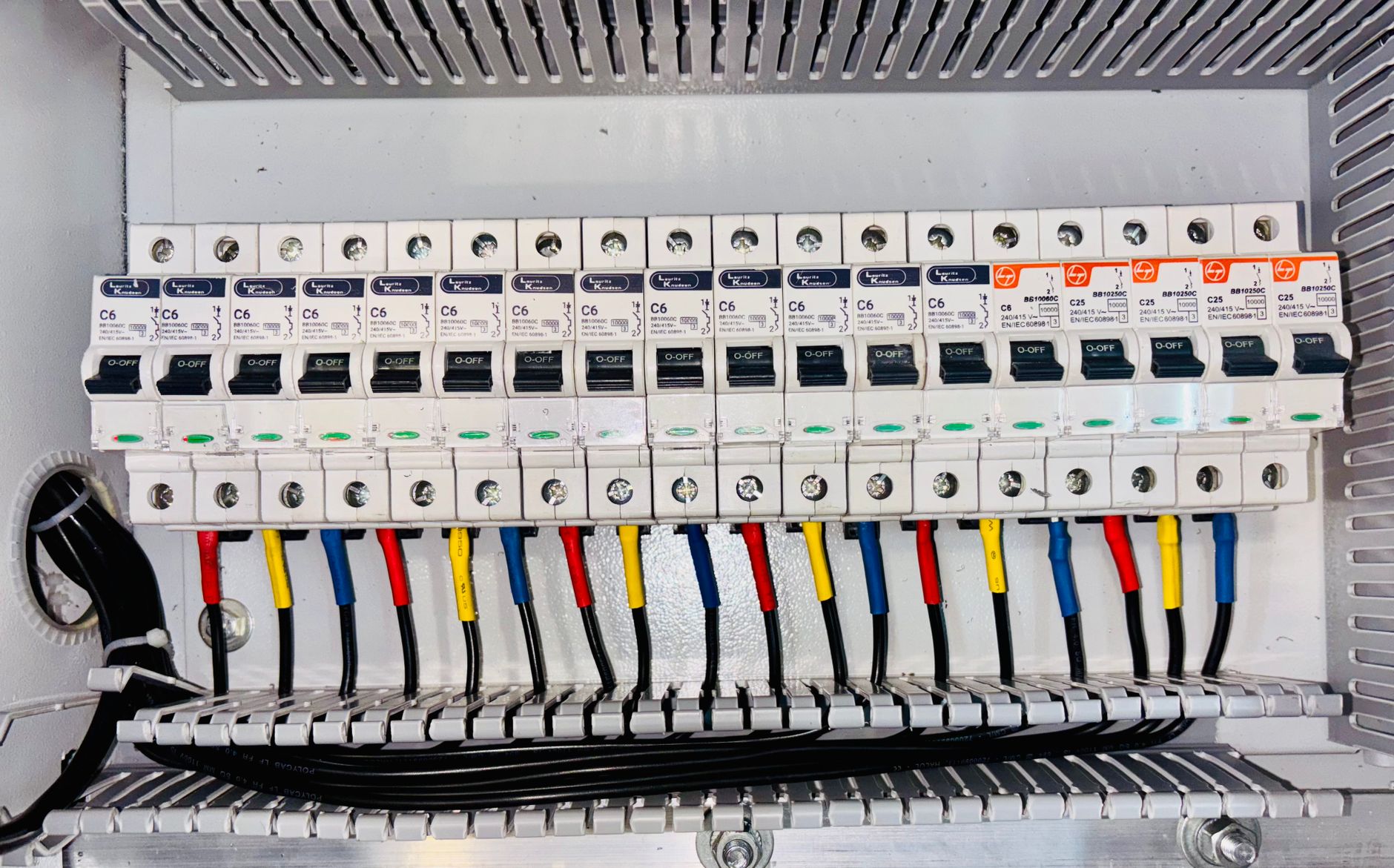 Rows of circuit breakers in an electrical panel