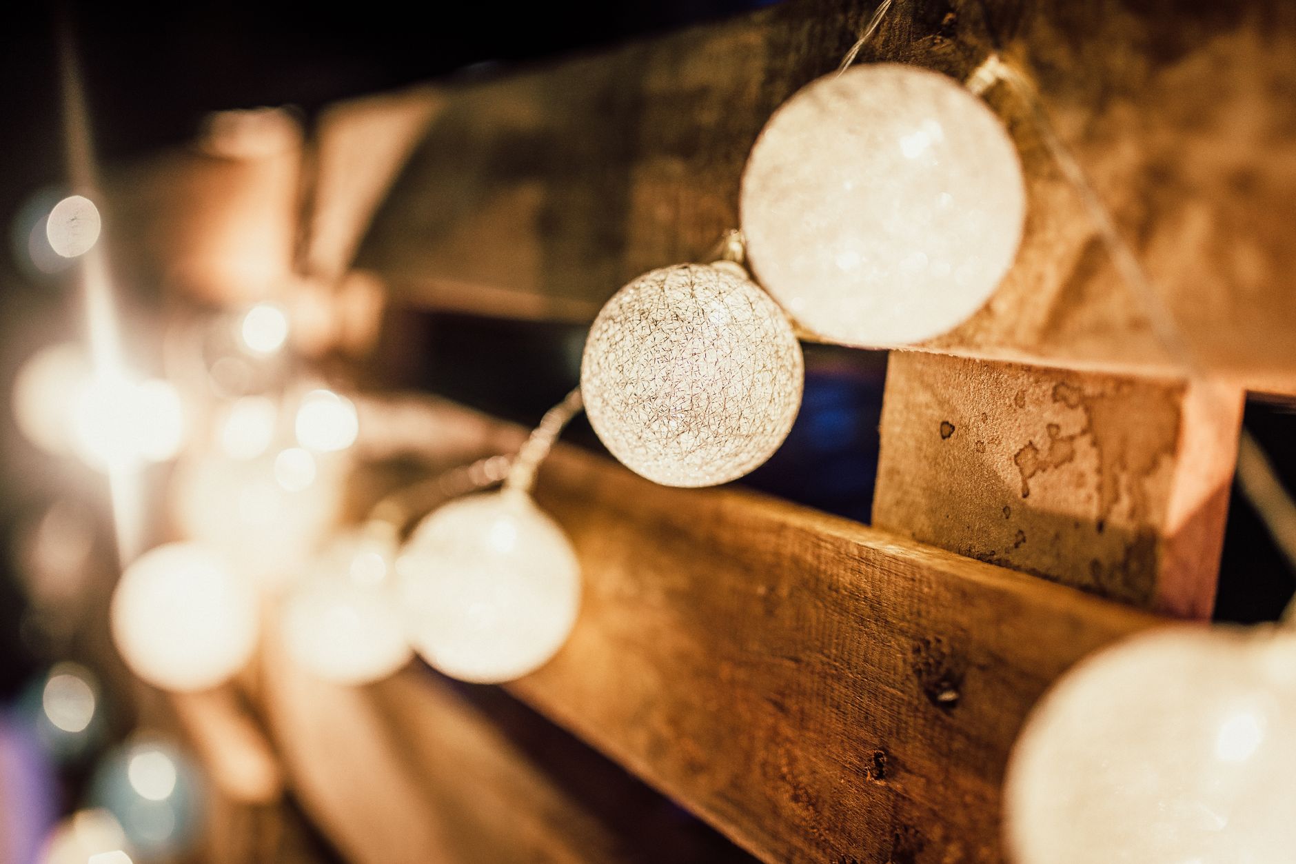String lights glowing over a backyard patio