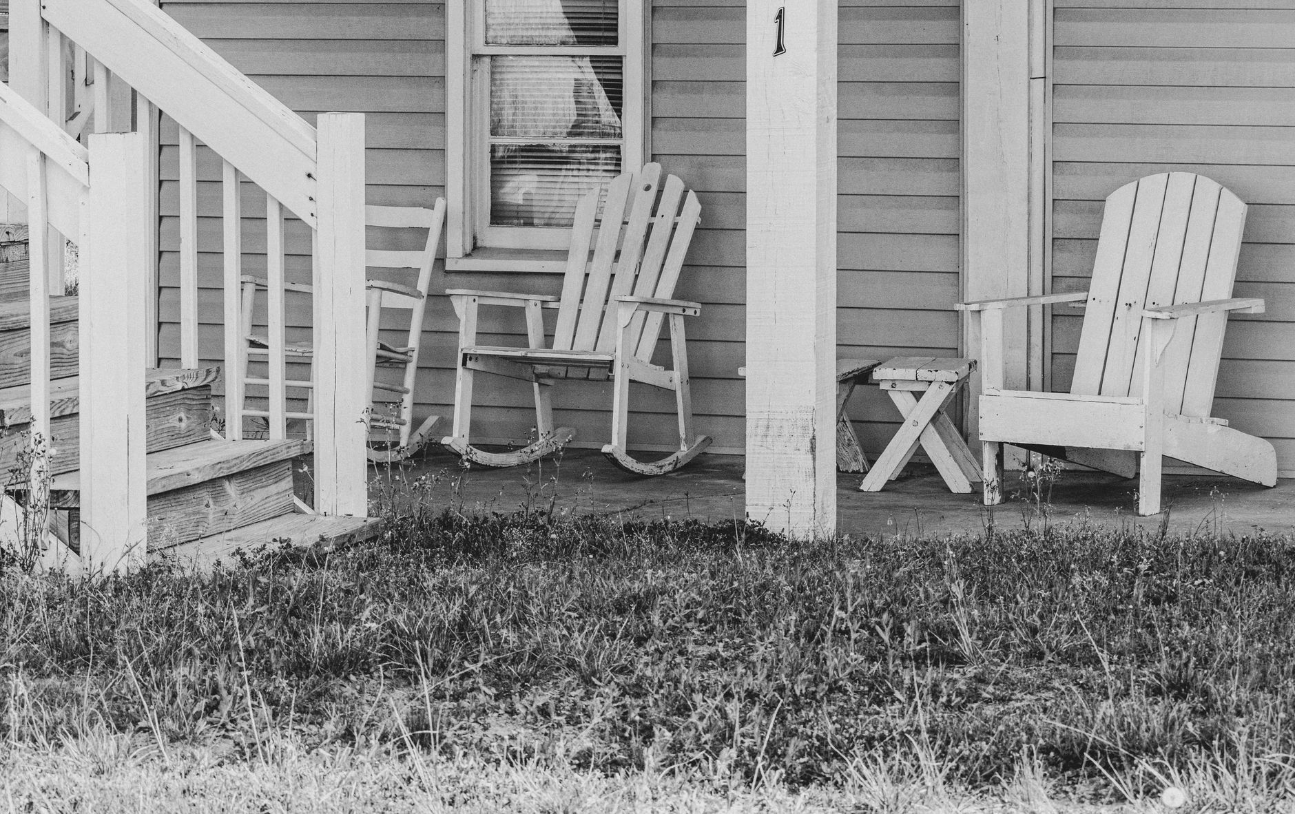 Chairs arranged on a front porch