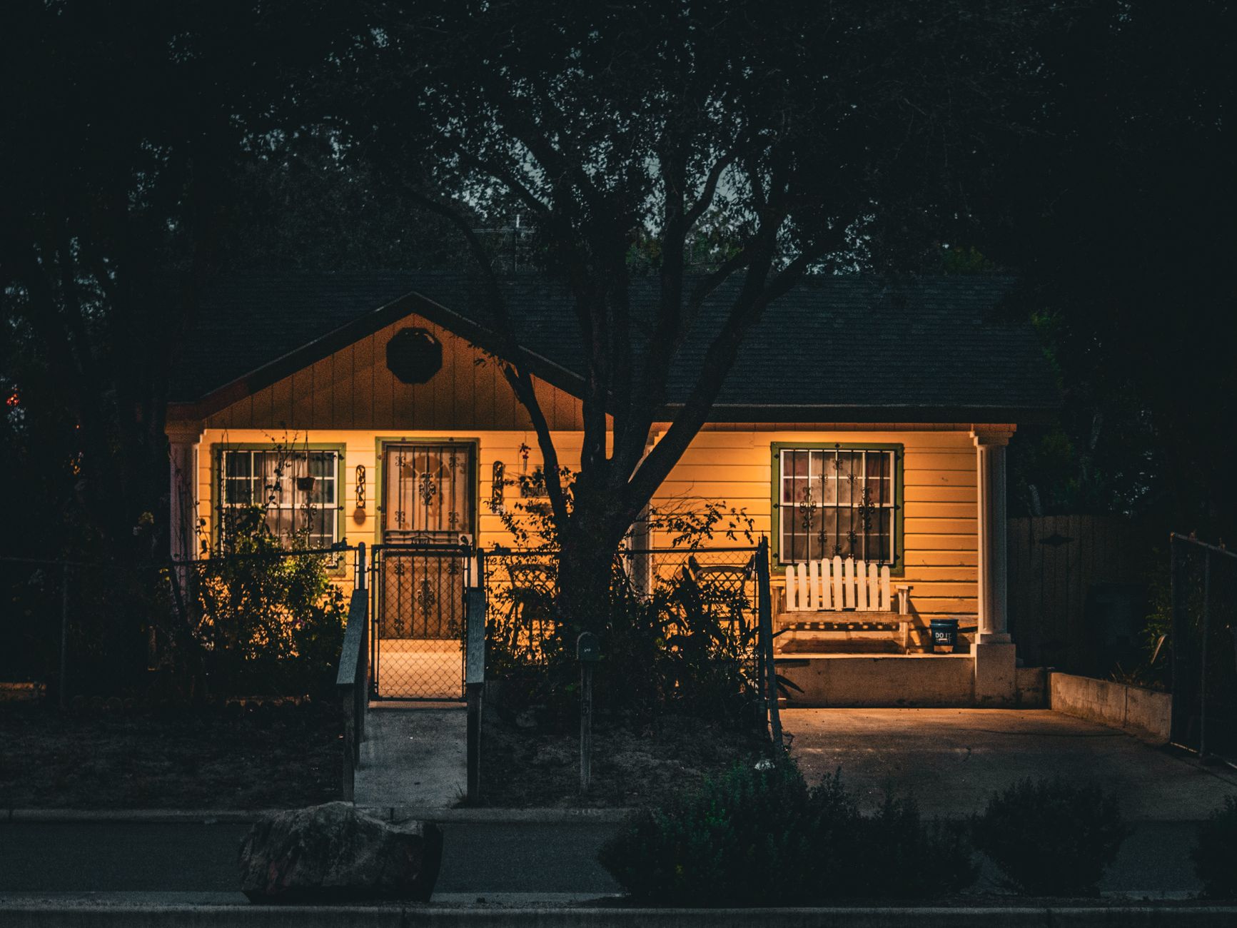 A small house lit at night
