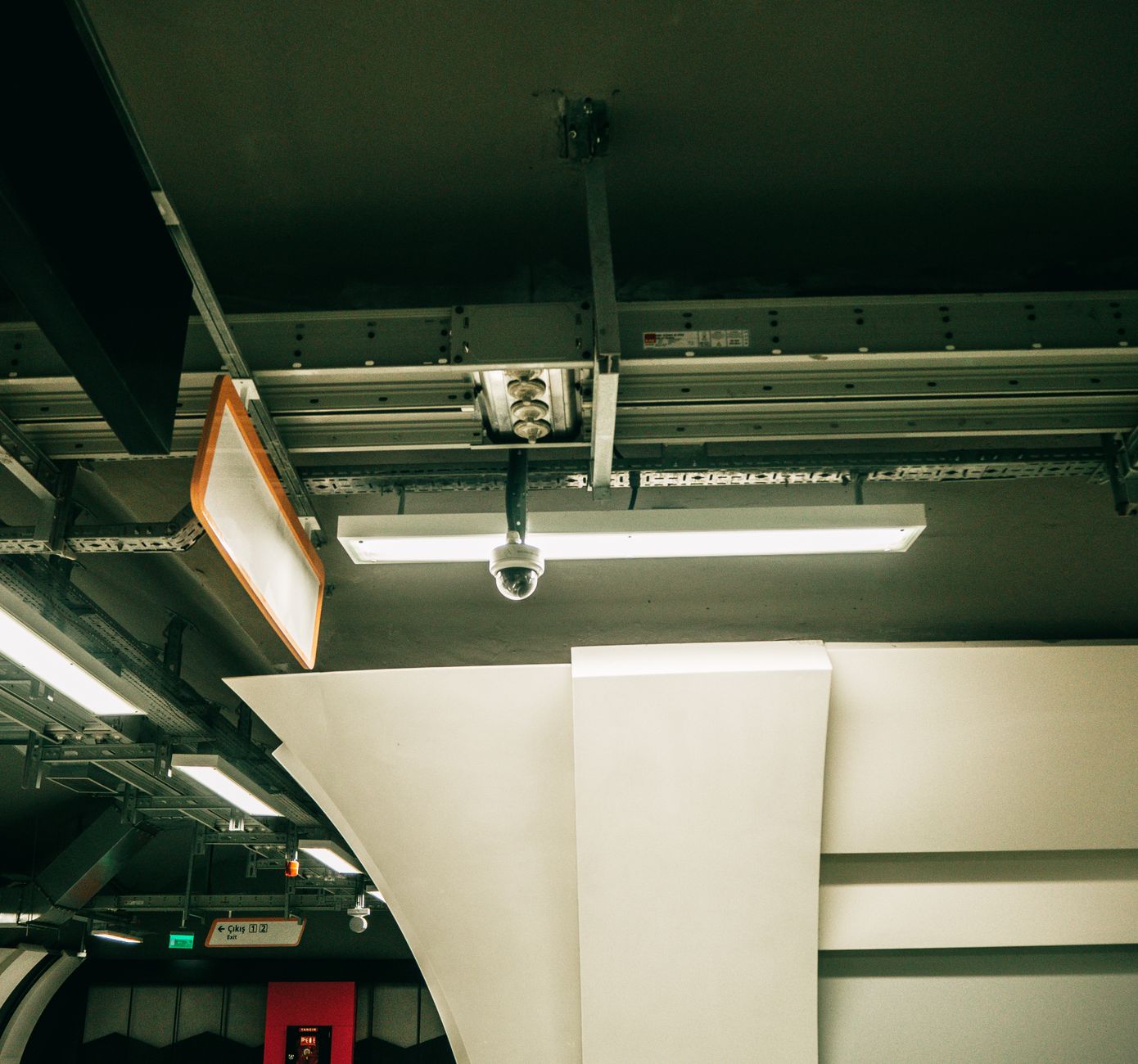 Ceiling-mounted lights and devices in an open ceiling