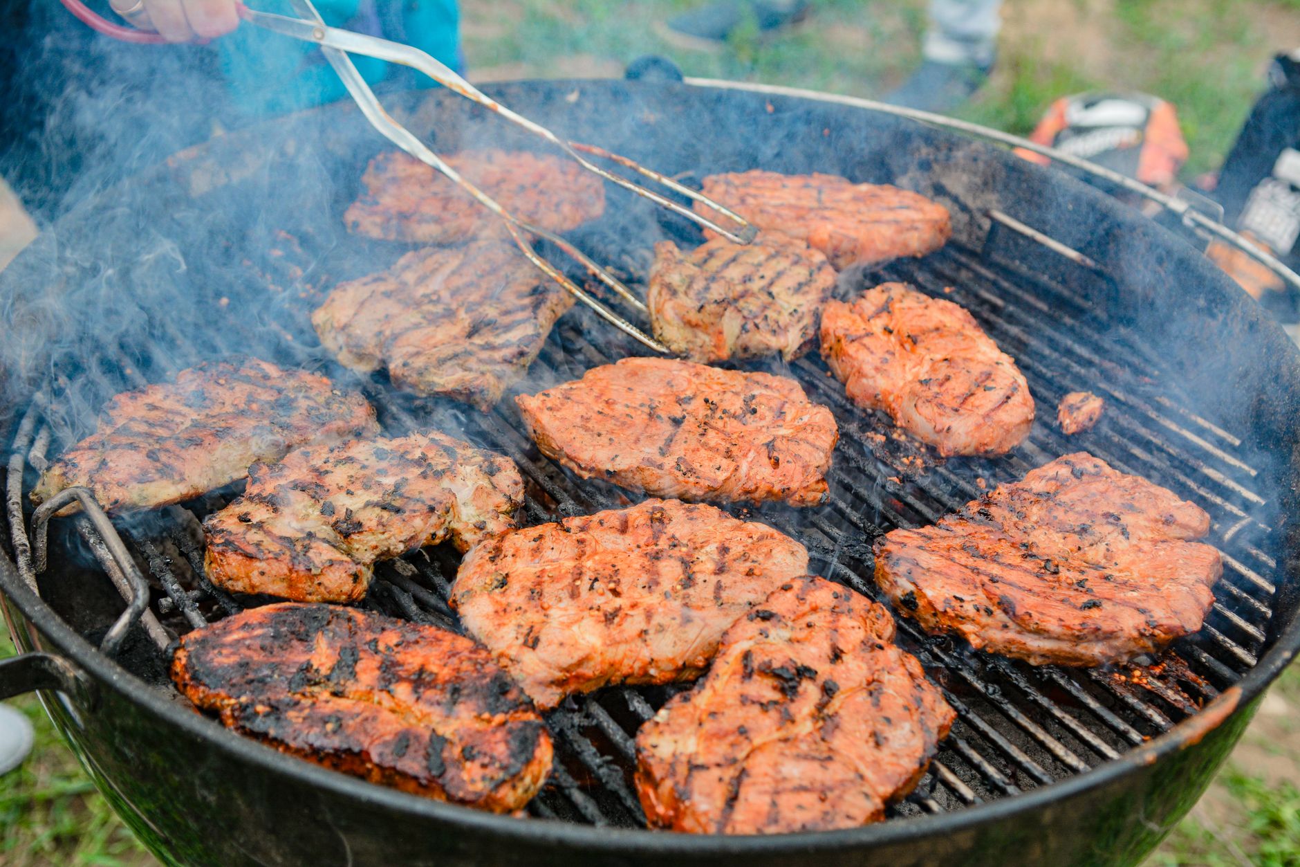 Meat cooking on a kettle grill