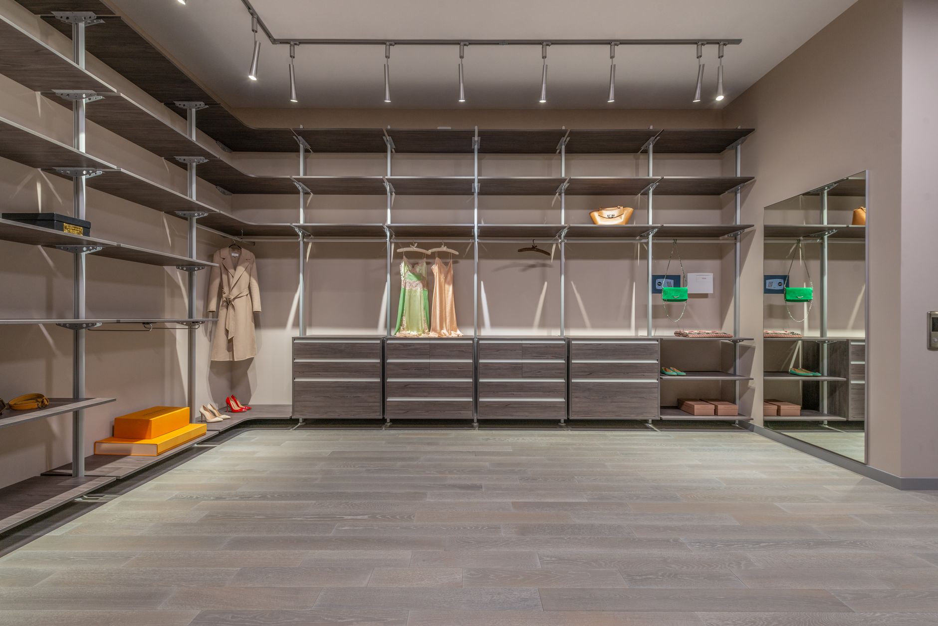 A walk-in closet with metal shelving