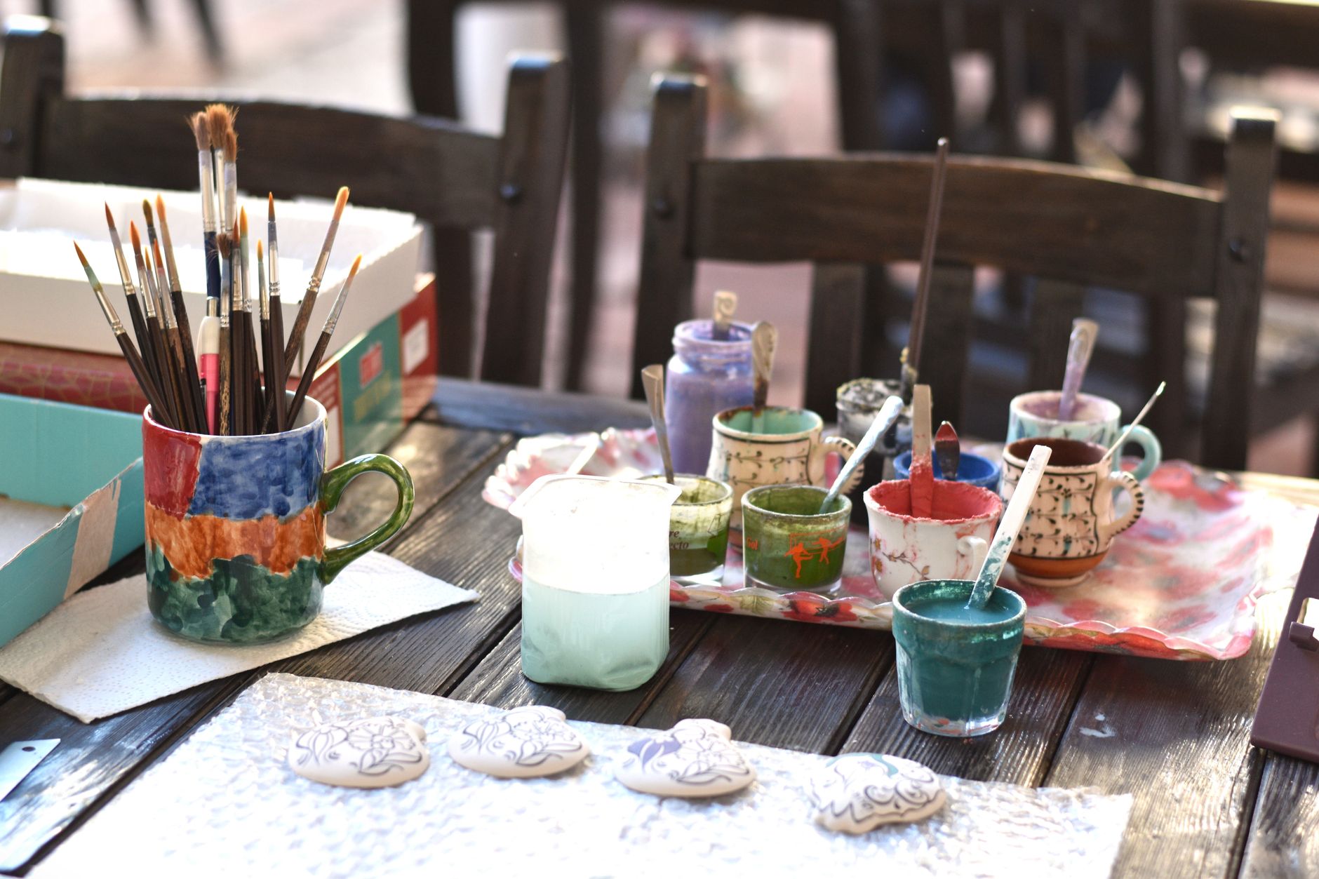 Paint brushes laid out on a table