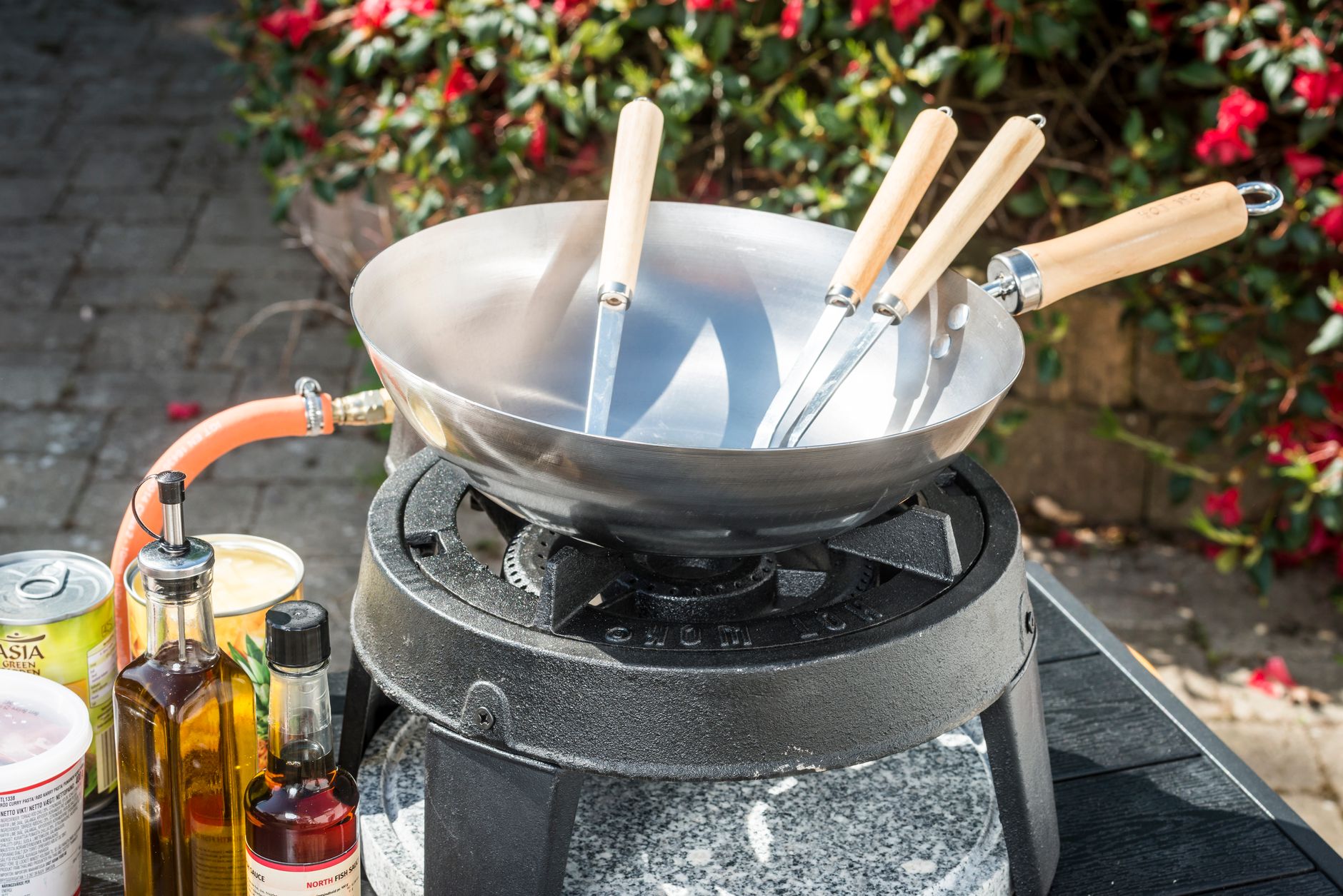 A wok on an outdoor gas burner