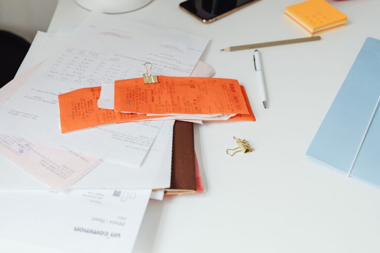 Best paper shredder: papers and folders on a home office desk