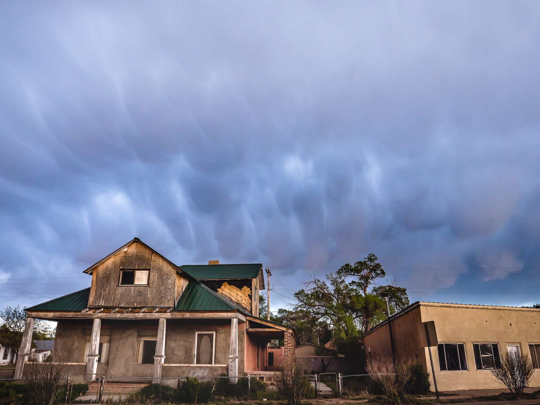 Storm clouds gathering over a house