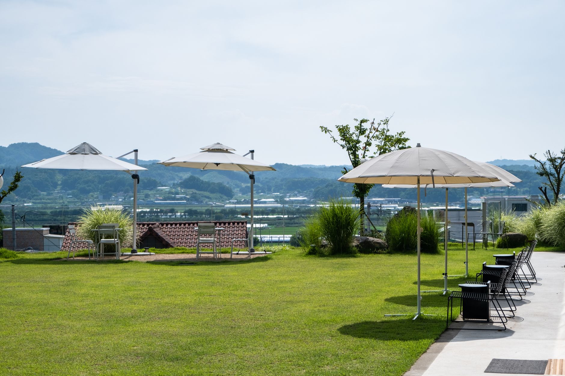 Best patio umbrella: an open umbrella shading an outdoor table