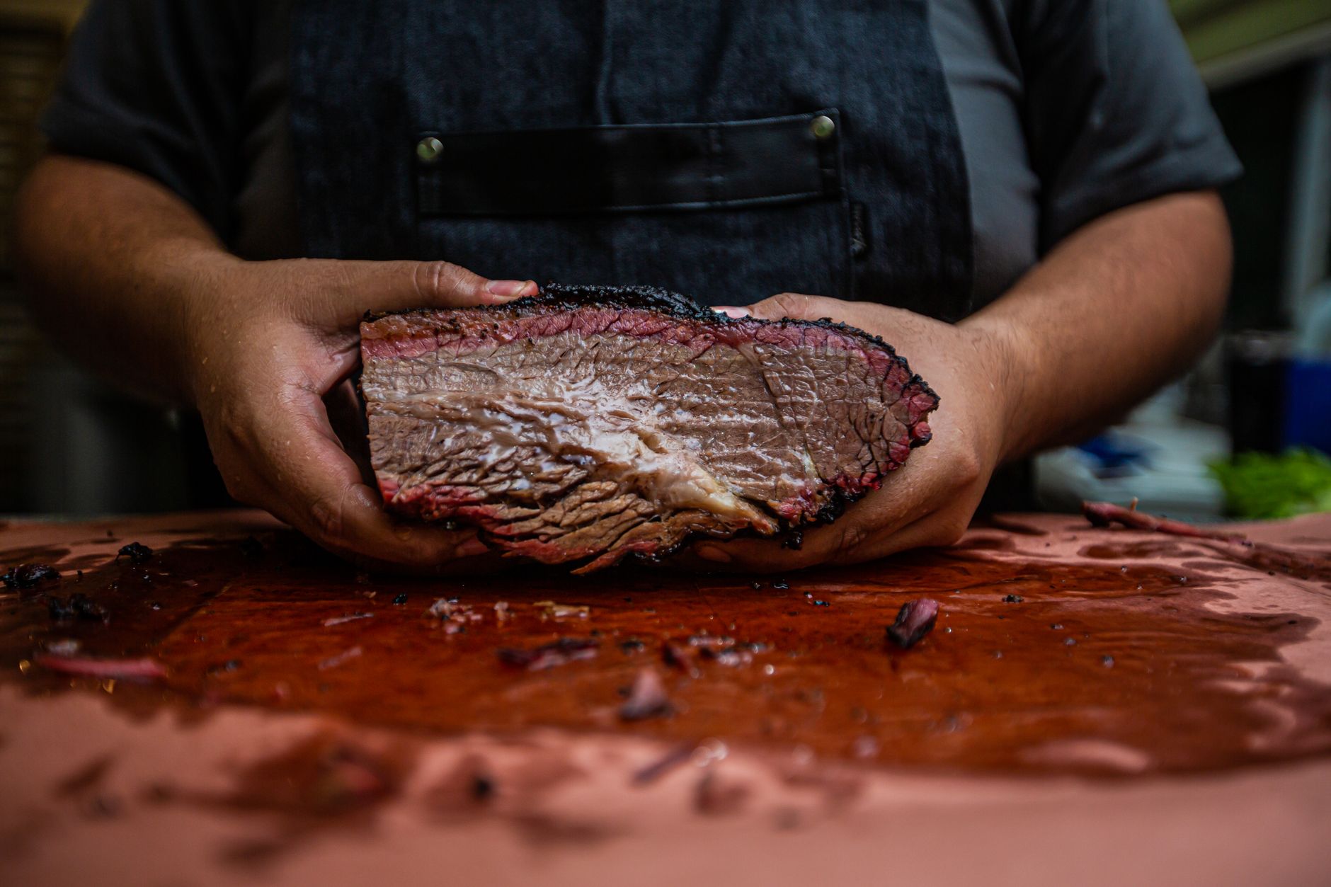 Sliced smoked brisket on a cutting board