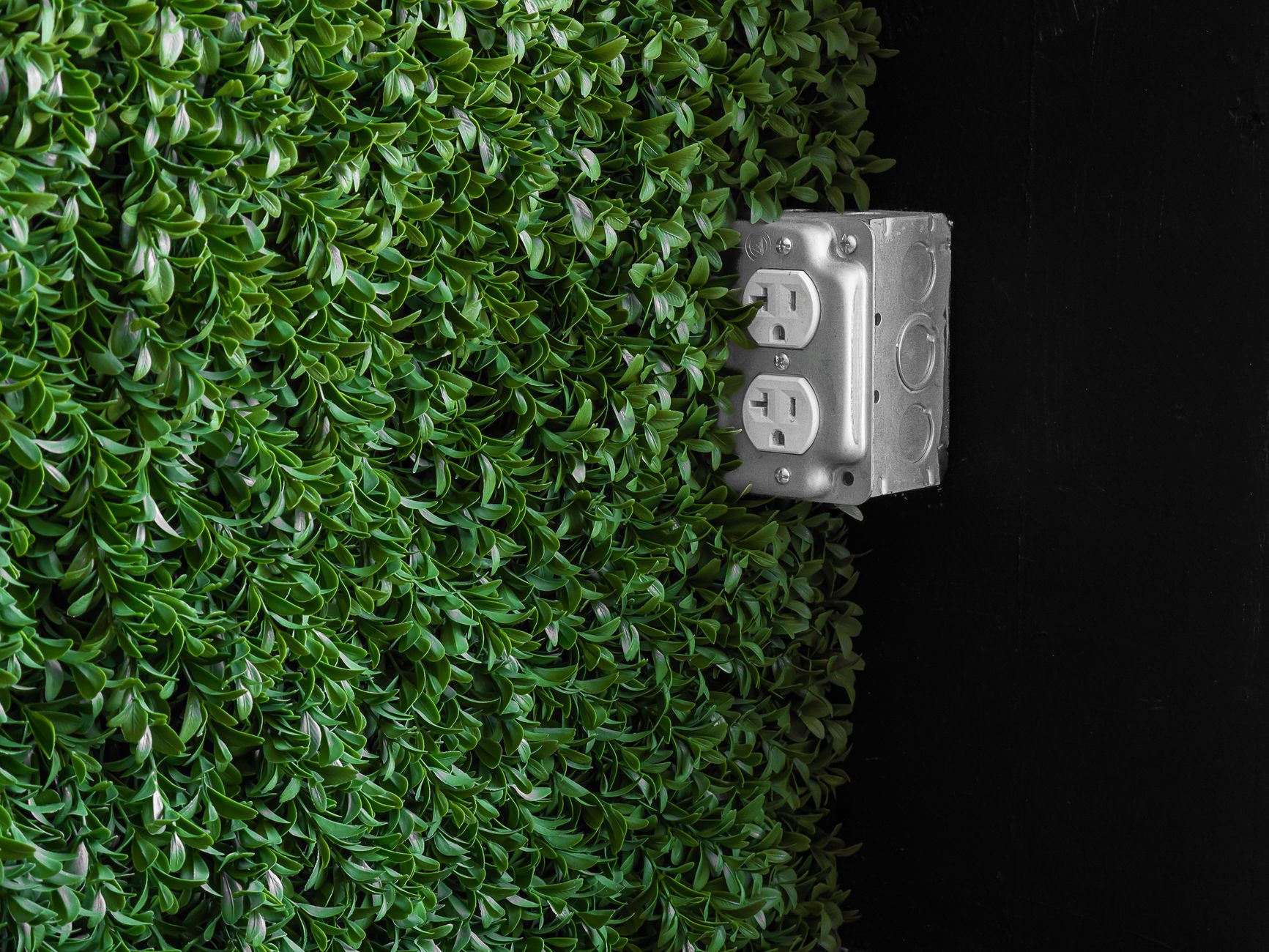 An outdoor electrical outlet on a wall