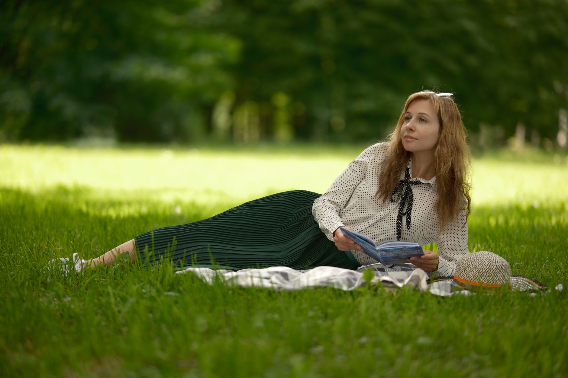 Best picnic blanket: a blanket spread out on the grass in a park