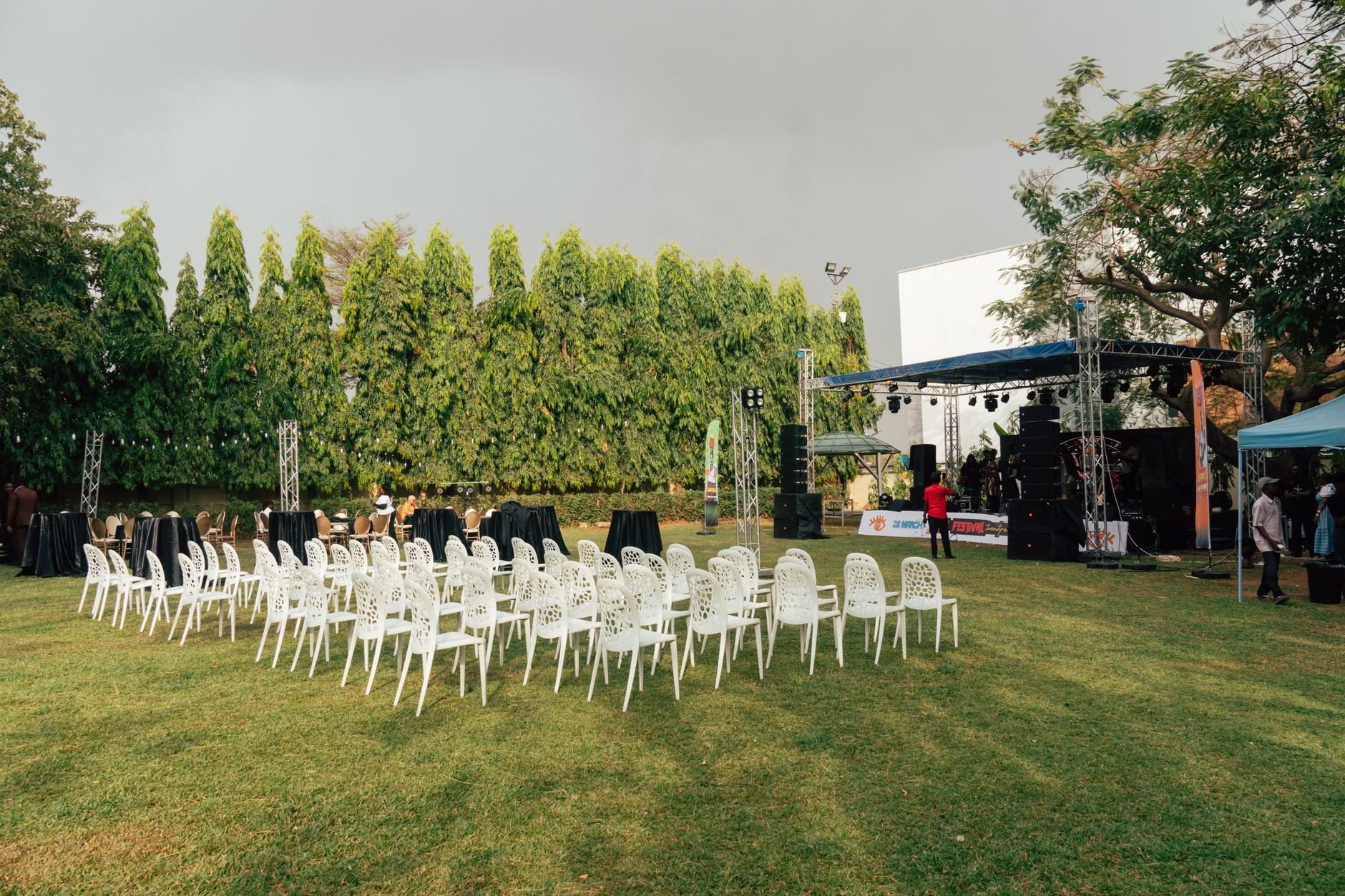 People sitting on the lawn at an outdoor event