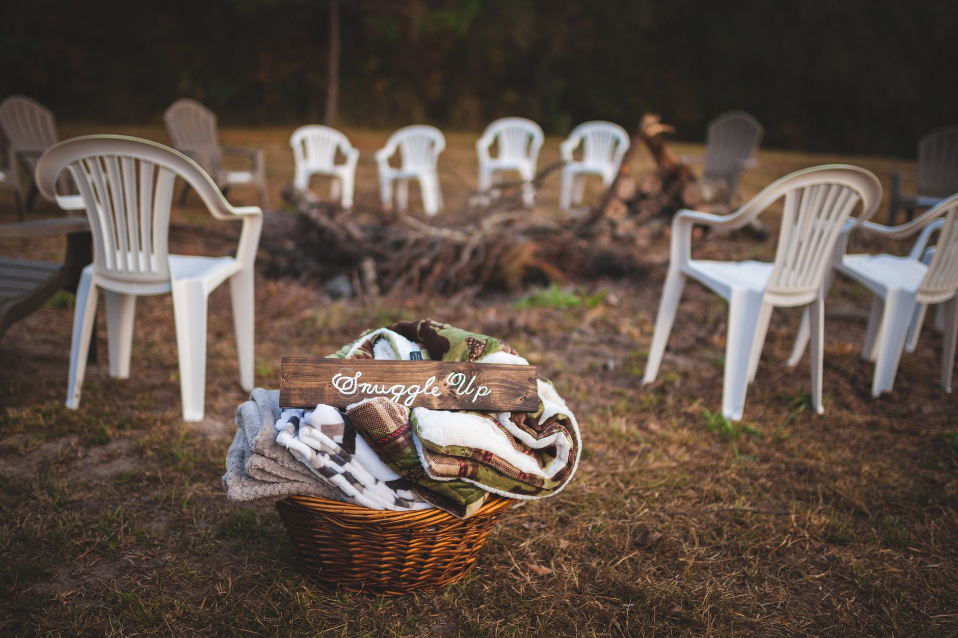A blanket by a campfire in the evening