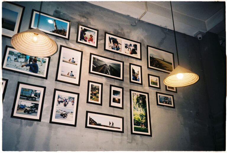 Best picture frames: framed photos arranged on a living room wall
