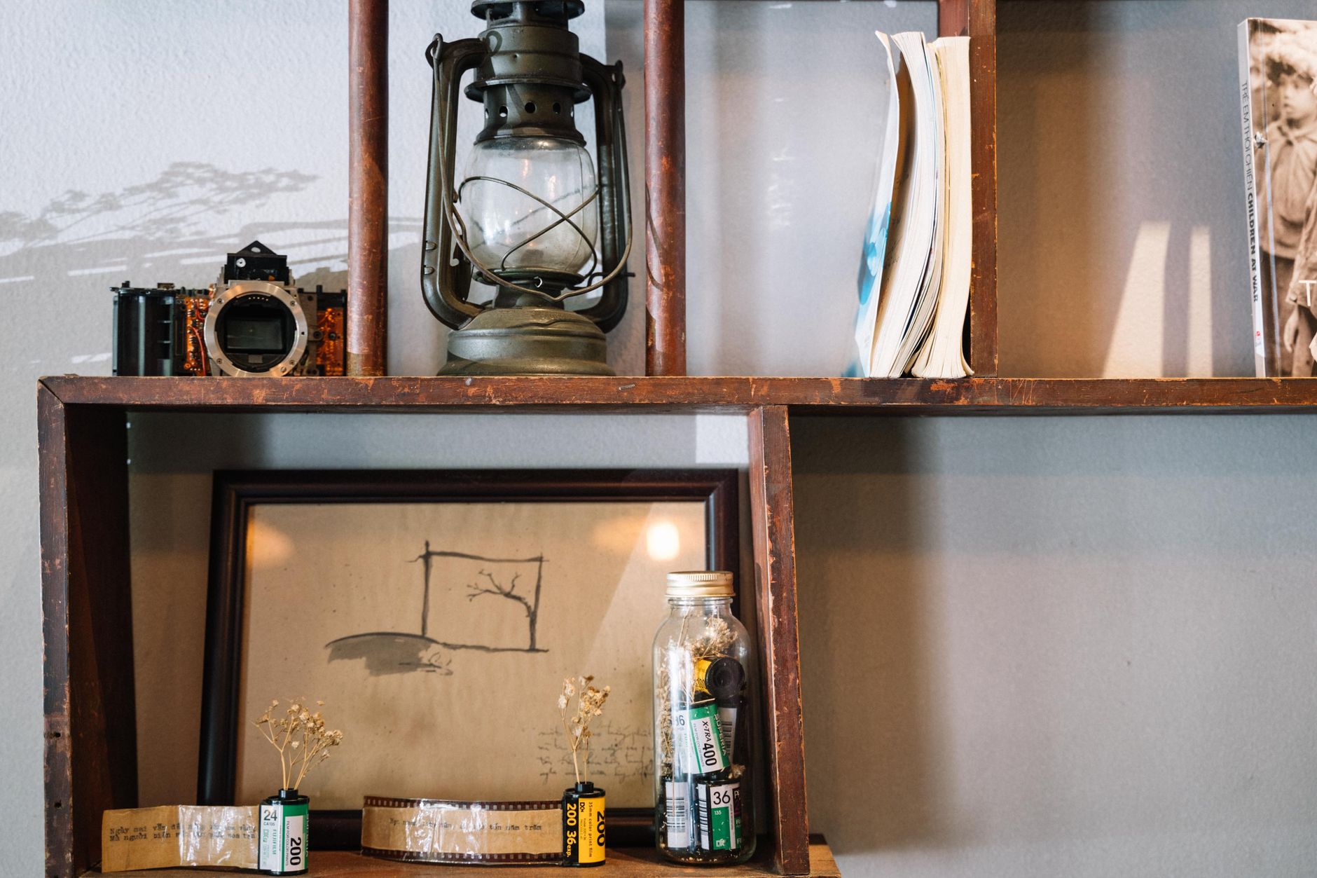 Framed photos displayed on a shelf