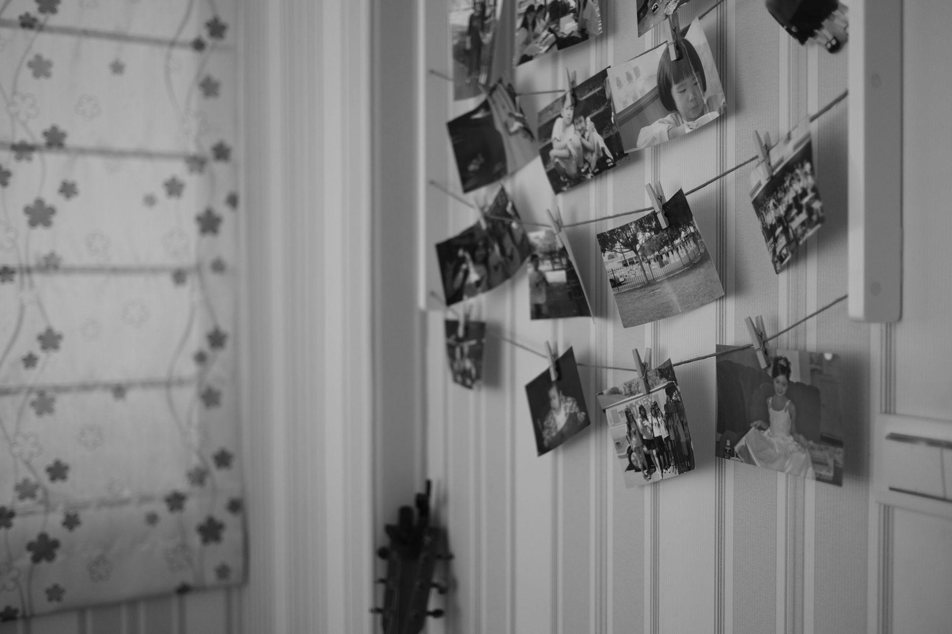 Family photos in frames on a wall