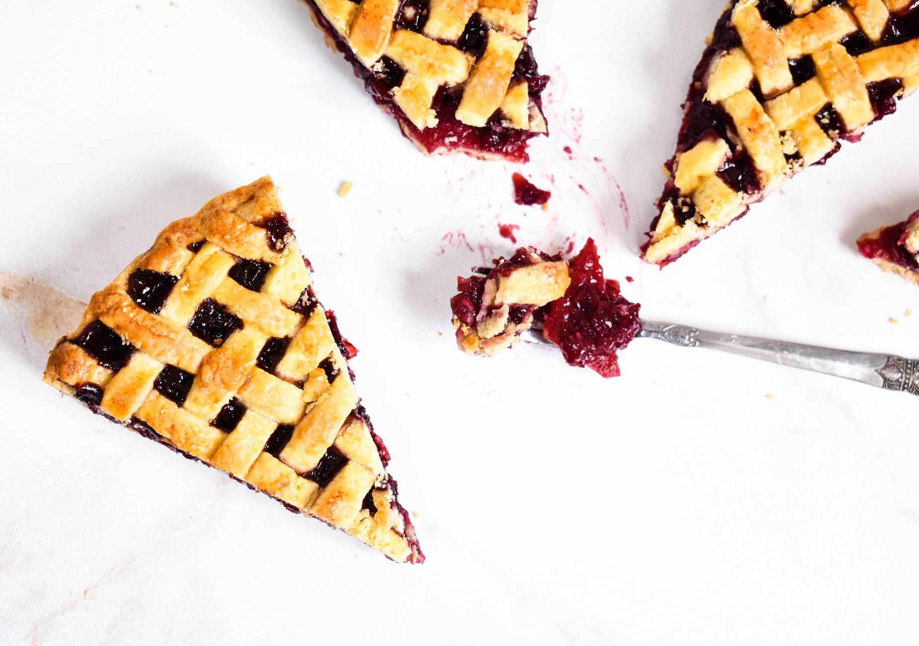 A slice of fruit pie on a plate