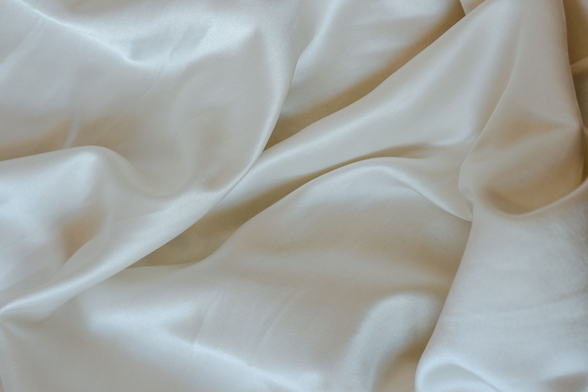 Smooth, shiny bedding fabric close up