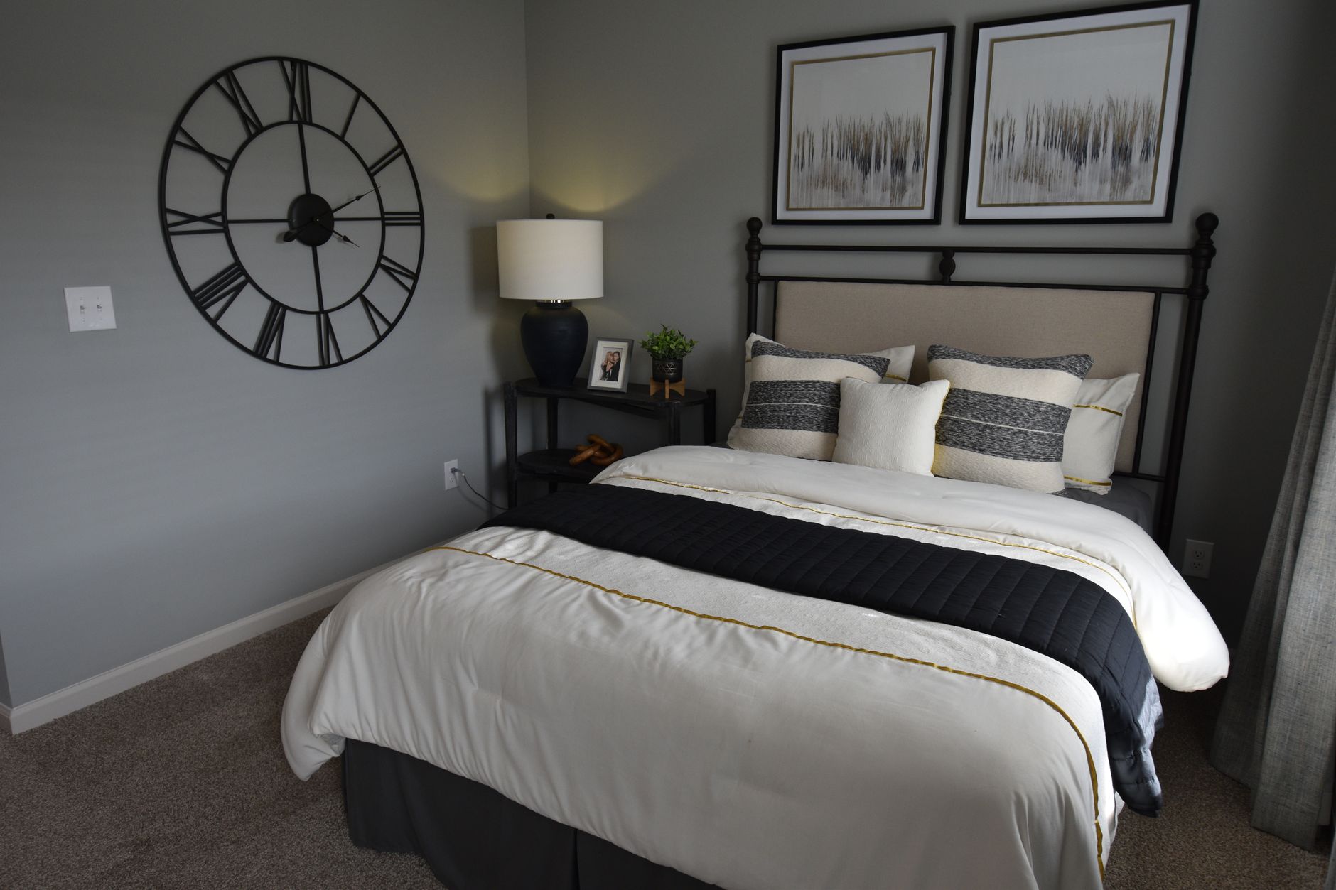 Grey pillowcases on a neatly made bed