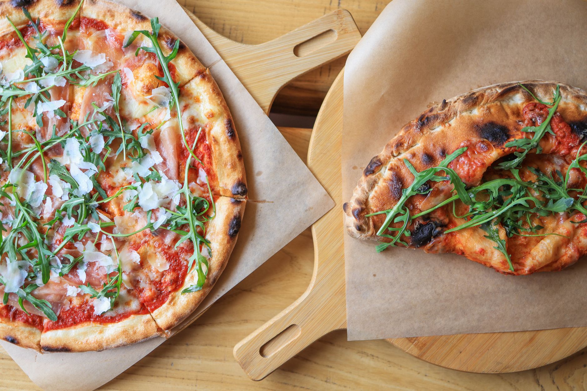 A pizza on a wooden board