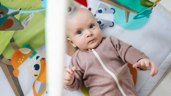 Best play mat: a soft play mat set up on a living room floor